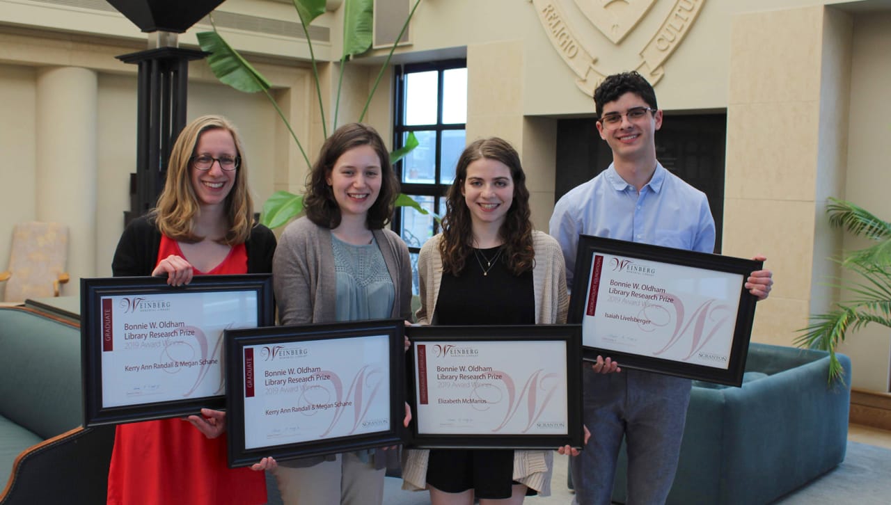 The University of Scranton Weinberg Memorial Library presented students with research awards at a reception held on campus recently. From left: recipients of the 2019 Bonnie W. Oldham Library Research Prize in the Graduate category Kerry Ann Randall and Megan Schane; recipient of the 2019 Bonnie W. Oldham Library Research Prize in the Undergraduate Upper-level category Elizabeth McManus; and recipient of the 2019 Bonnie W. Oldham Library Research Prize in the Undergraduate Foundational category Isaiah Livelsberger.