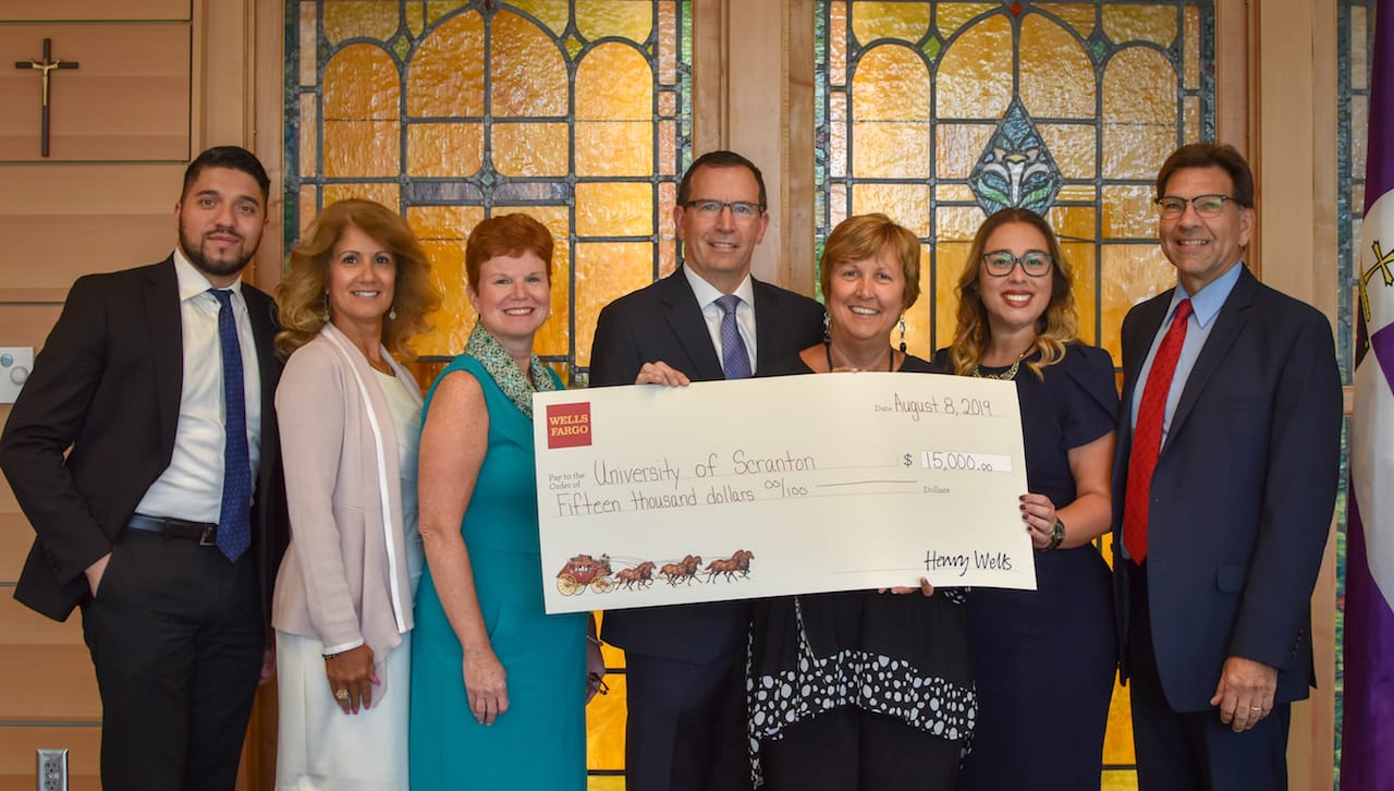 Wells Fargo contributed $15,000 to The University of Scranton’s University of Success, a multi-year, pre-college program for high school students. From left are: Oiram Santos, community bank district manager, Wells Fargo; Jannette Moran, program manager, Wells Fargo At Work; Meg Hambrose, director of corporate and foundation relations, The University of Scranton; Frank Subasic, Regional Brokerage Manager, Wells Fargo Advisors;  Debra Pellegrino, Ed.D., dean of the Panuska College of Professional Studies, The University of Scranton; Maria Vital, Ph.D., operations manager at the Leahy Community Health and Family Center; The University of Scranton; and Michael Pany, community relations senior consultant, Wells Fargo.
