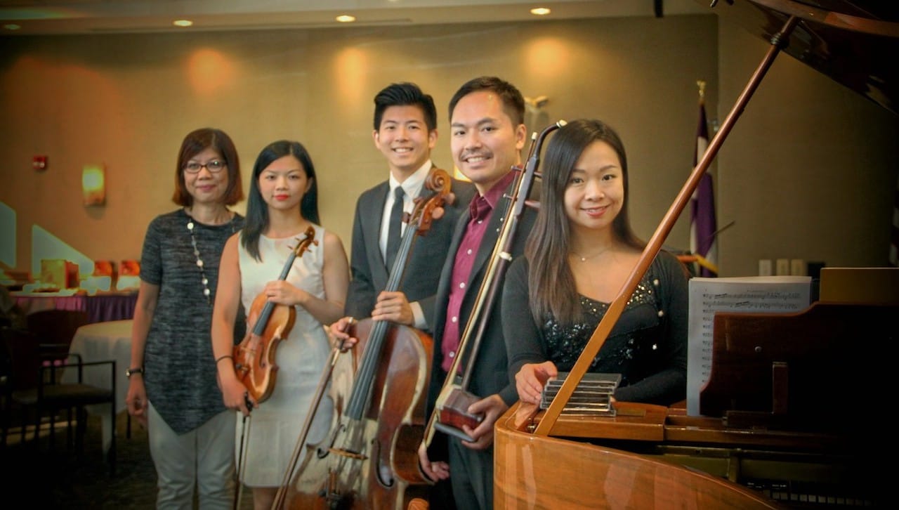 The Asian Studies Program at The University of Scranton celebrated the 2019 Asian Moon Festival with an interactive performance with the renowned New Asia Chamber Music Society that included an educational workshop, tea/coffee tasting and a sampling of Asian moon cake. From left: Ann A. Pang-White, Ph.D., director of Asian Studies and professor of philosophy at the University; and members of the New Asia Chamber Music Society I-Jung Huang; Nan-Cheng Chen; Andy Lin, Ph.D.; and Kelly Yu-Chieh Lin, Ph.D.