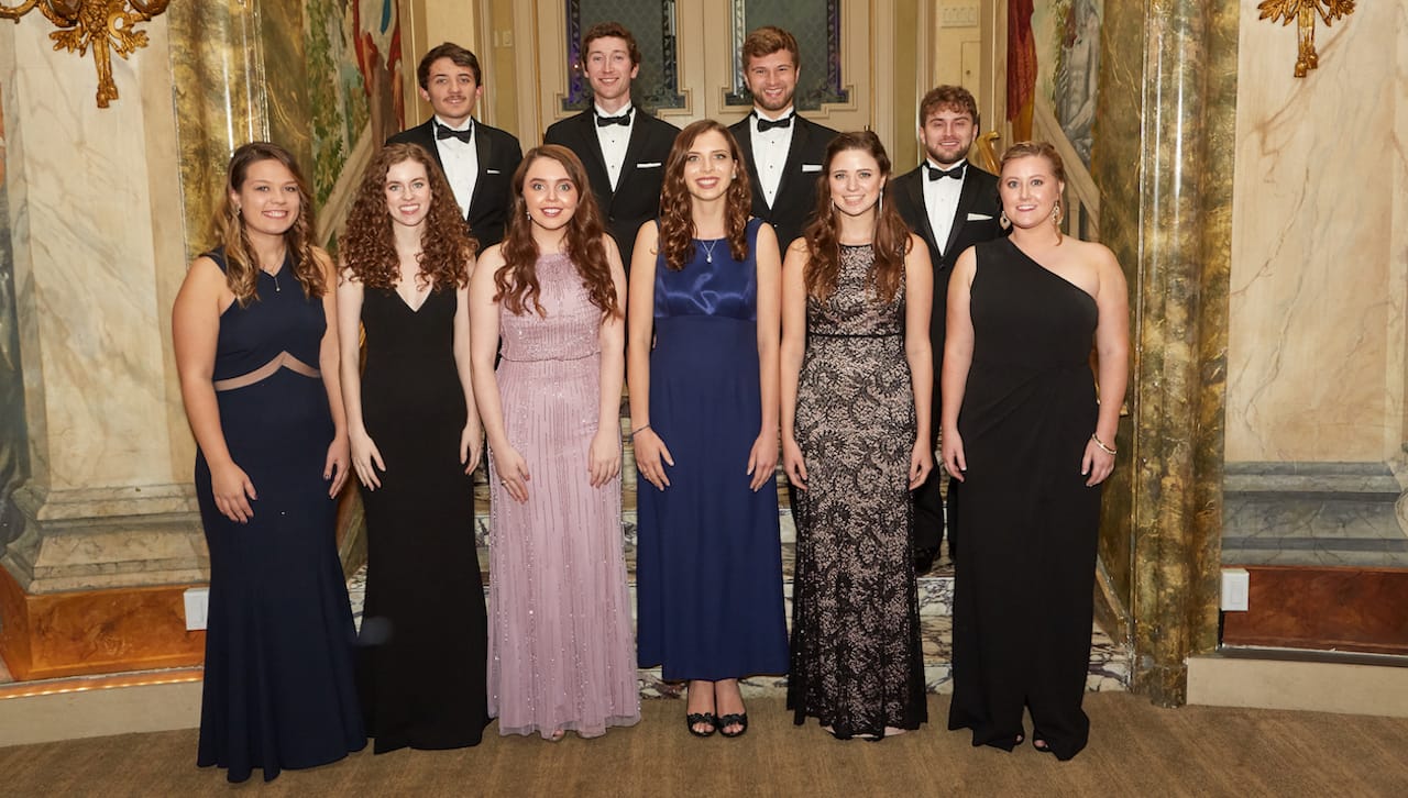 Presidential Scholars of The University of Scranton’s class of 2020 attended the President Business Council’s 18th Annual Award Dinner at The Pierre. Proceeds from the annual dinner support the University’s Presidential Scholarship Endowment Fund. First row, from left: Katherine Musto, Pittston, a biology major in the undergraduate Honors Program; Megan Dowd, Wilkes-Barre, a biology and philosophy double major in the Special Jesuit Liberal Arts Honors Program; Kathryn Donnelly, Havertown, a neuroscience and philosophy double major in the Special Jesuit Liberal Arts Honors Program; Megan Fabian, West Seneca, New York, an exercise science and philosophy double major in the Special Jesuit Liberal Arts Honors Program; Zoë Haggerty, South Abington Township, a philosophy and theology double major in the Special Jesuit Liberal Arts Honors Program; and Colleen Rohr, Norristown, a marketing, operations management and philosophy triple major in the Special Jesuit Liberal Arts Honors Program and the Business Leadership Honors Program. Second row: Daniel Tartaglione, Pocono Summit, a mathematics and computer science double major who is also pursuing a master’s degree in software engineering; Brian Kilner, Potomac, Maryland, an environmental science, biochemistry and philosophy triple major in the Special Jesuit Liberal Arts Honors Program and the Magis Honors Program in STEM; Brian Martin, Scranton, a biology and philosophy double major in the Special Jesuit Liberal Arts Honors Program; and Joshua Toth, Jefferson Township, a biophysics and physics double major in the undergraduate Honors Program and the Magis Honors Program in STEM.