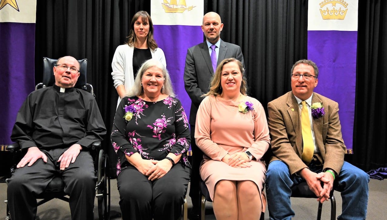 The University of Scranton presented Sursum Corda (Lift Up Your Hearts) Awards to four staff members at a convocation held on campus this month. The award recognizes members of the University’s professional/paraprofessional staff, clerical/technical staff and maintenance/public safety staff who have made outstanding contributions to the life and mission of the University. First row, from left, are: Rev. Scott R. Pilarz, S.J., president; Sursum Corda Award recipients Donna Simpson, Bryn Schofield and John Harris. Second row: Patricia Tetreault, vice president for human resources., and Jeffrey Gingerich, Ph.D., senior provost and vice president of academic affairs. Sursum Corda Award recipient Andrea Mantione, D.N.P., was absent from the photo.