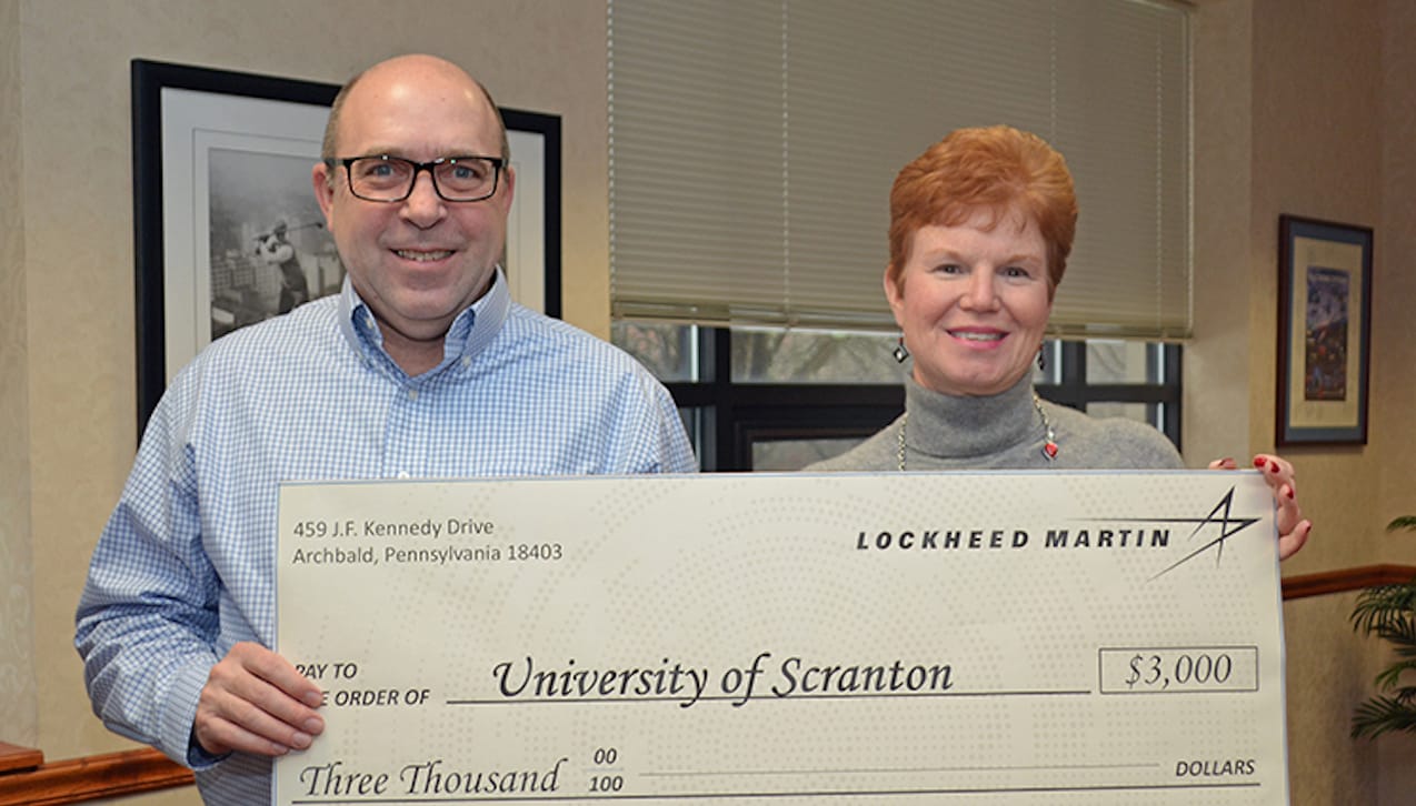 Lockheed Martin’s Archbald Operations presented a check to The University of Scranton in the amount of $3,000 to support their student Veterans’ Club. From left: Todd Santos, business operations director of Lockheed Martin’s Archbald Operations, and Margaret Hambrose, director of corporate and foundation relations at The University of Scranton.