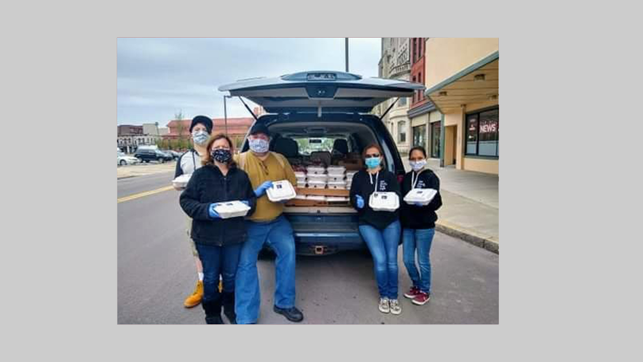 The Black Box Cafe staff delivers catered meal to residents of Finch Towers.