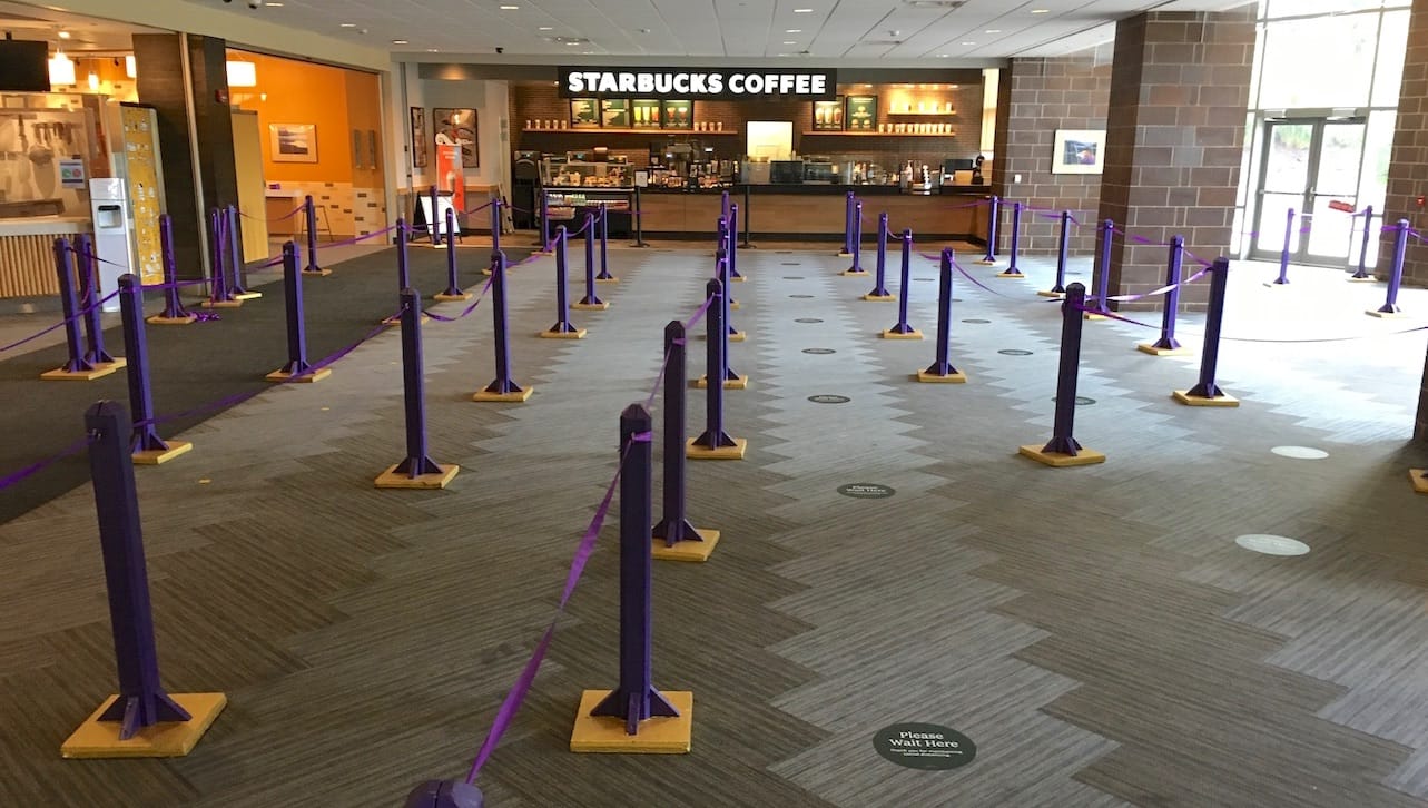 The first-floor dining area of the DeNaples Center has been reconfigured and signage has begun to be added to remind community members of social distancing recommendations. 