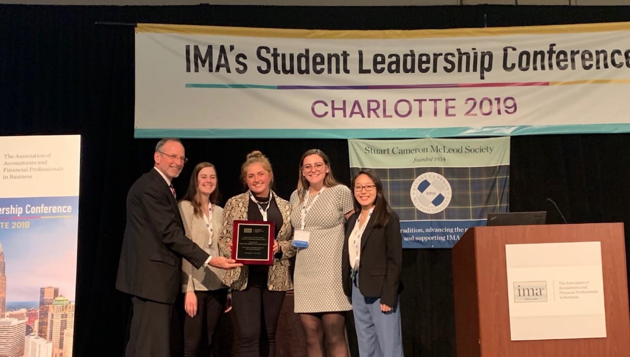 The Institute of Management Accountants (IMA) named The University of Scranton’s student chapter as one of just five Outstanding Student Chapters in the nation for the 2019-2020 academic year. This is the second consecutive year the University’s student chapter received this honor. At IMA’s 2019 student leadership conference accepting the award for 2018-2019 are, from left: Paul Juras, Ph.D., chair of IMA Global Board of Directors; 2019-2020 officers of the University’s IMA student chapter: Rosemary Wolf, vice president; Grace Gallagher, secretary; Sarin Baldante, treasurer; and Ngoc Nguyen, president. 