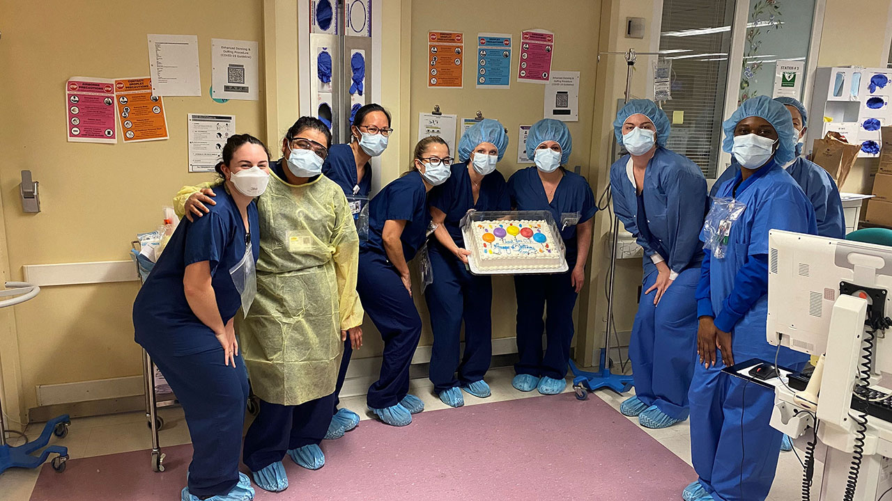 Ledetsch and her colleagues get ready to present a birthday cake to a patient in the COVID ICU unit. They all also sang "happy birthday" to the patient, who was being both incubated and sedated at the time.