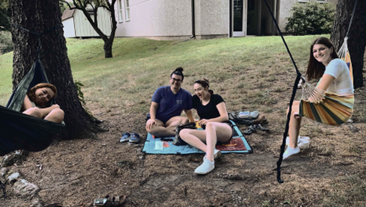 Fischetti hammocking with her friends behind Alumni Memorial Hall.