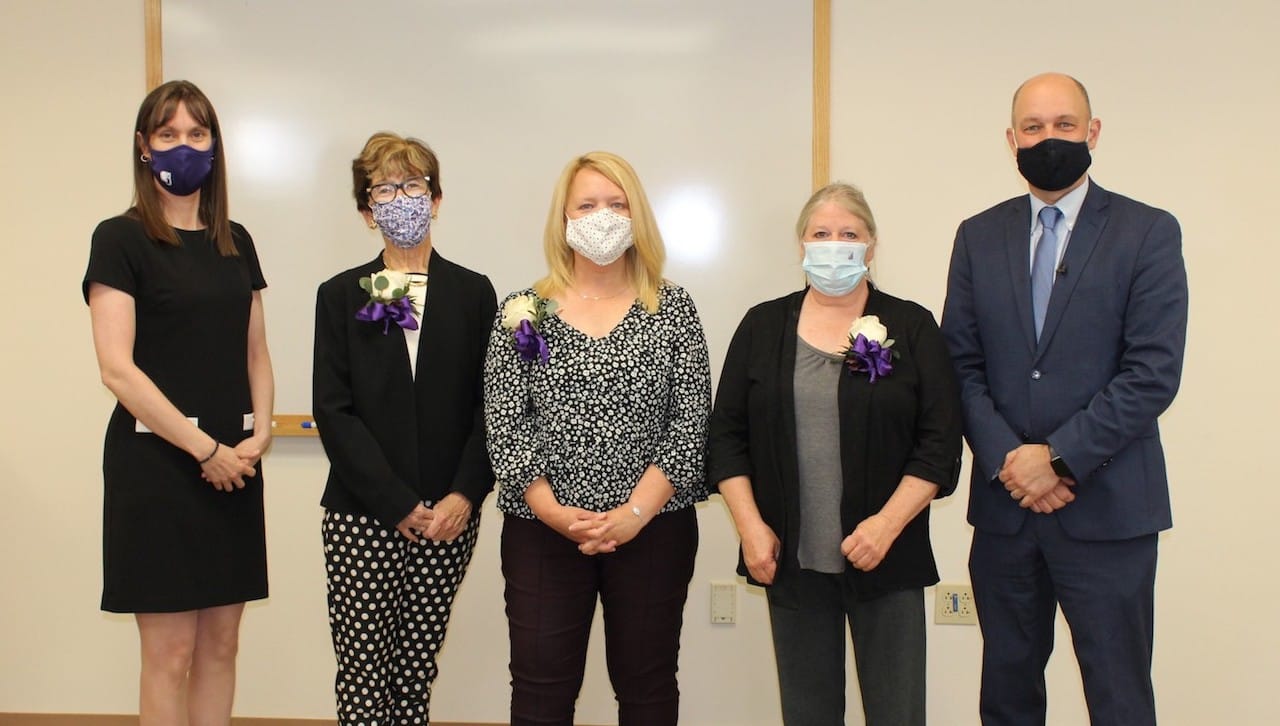 The University of Scranton presented Sursum Corda (Lift Up Your Hearts) Awards to three staff members at a ceremony on campus this month. The award recognizes members of the University’s professional/paraprofessional staff, clerical/technical staff and maintenance/public safety staff who have made outstanding contributions to the life and mission of the University. From left are: Patricia Tetreault, vice president for human resources; Sursum Corda Award recipients Maryjane Rooney, director of strategic outreach and presidential events, Kim Hurst, payroll specialist, and JoAnn Stavisky, caretaker of the Retreat Center at Chapman Lake; and Jeffrey Gingerich, Ph.D., acting president and senior provost and vice president of academic affairs. 