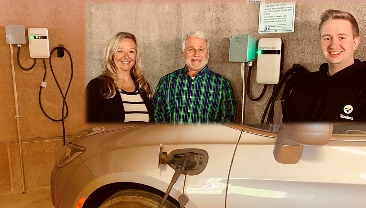 Catherine Sanderson, coordinator, Parking Services, Mark Murphy, director of Sustainability, and Nathaniel Smith, Sustainability Office work-study student