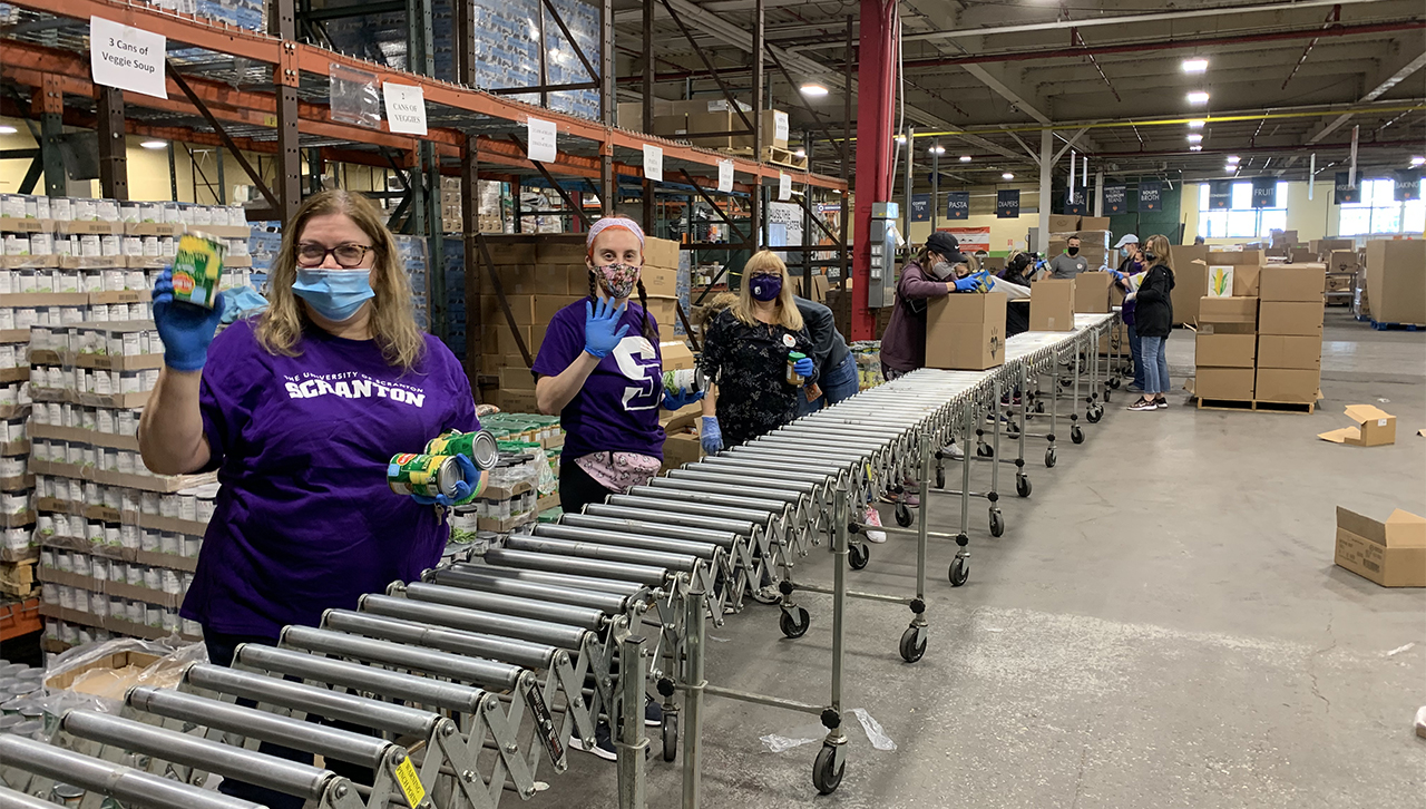 Royals sort non-perishable food items at Community Bank of New Jersey in April.