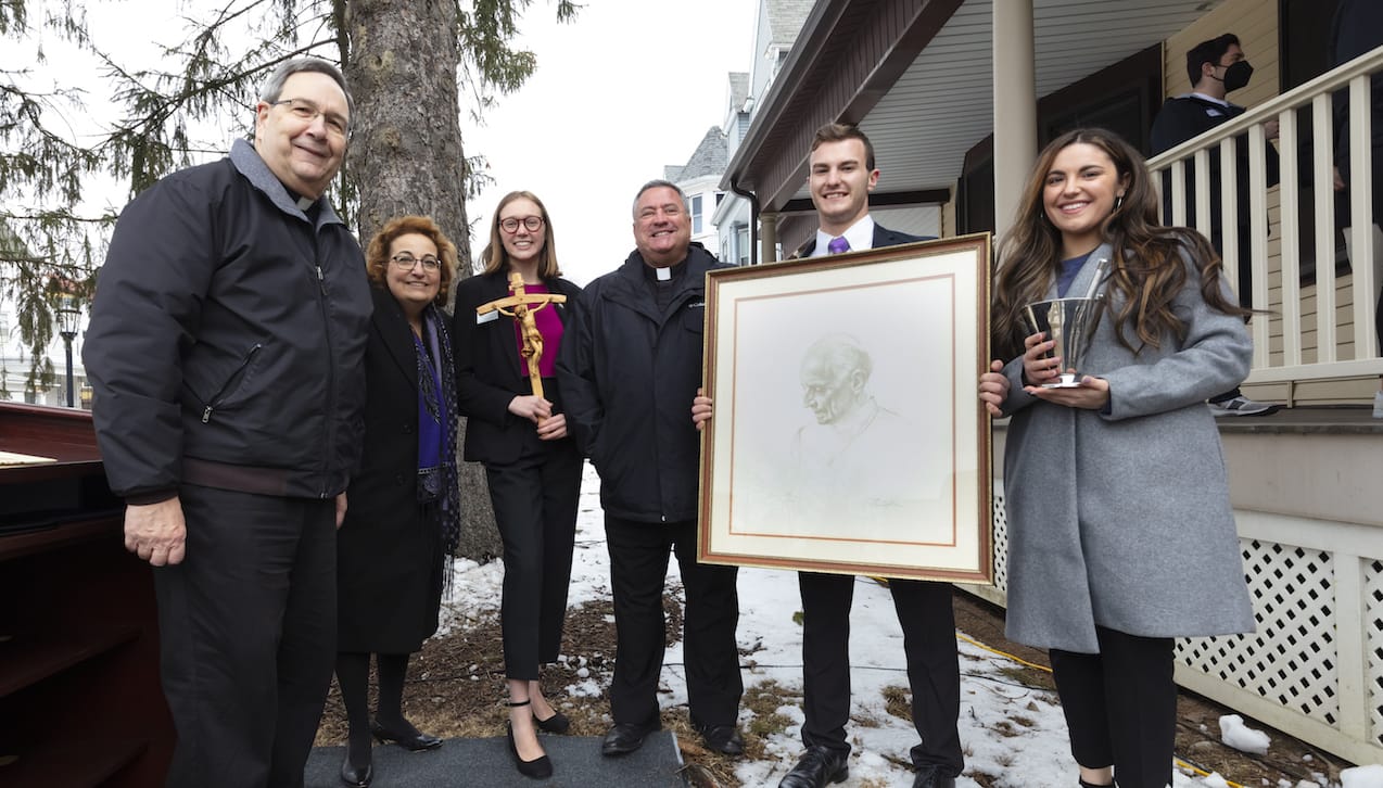 Rev. Joseph Marina, S.J., president of The University of Scranton, dedicated Rev. Pedro Arrupe, S.J., House, which will be used for several student volunteer programs offered through the University’s Center for Service and Social Justice. Participating in the dedication ceremony were, from left: Rev. Herbert B. Keller, S.J., vice president for Mission and Ministry; Patricia Vaccaro, director of the Center for Service and Social Justice; Shannon Everton, an occupational therapy graduate student and a graduate assistant for The Center for Service and Social Justice; Father Marina; Brandon Dagrosa, a health administration major; and Avianna Carilli, a counseling and human services major.