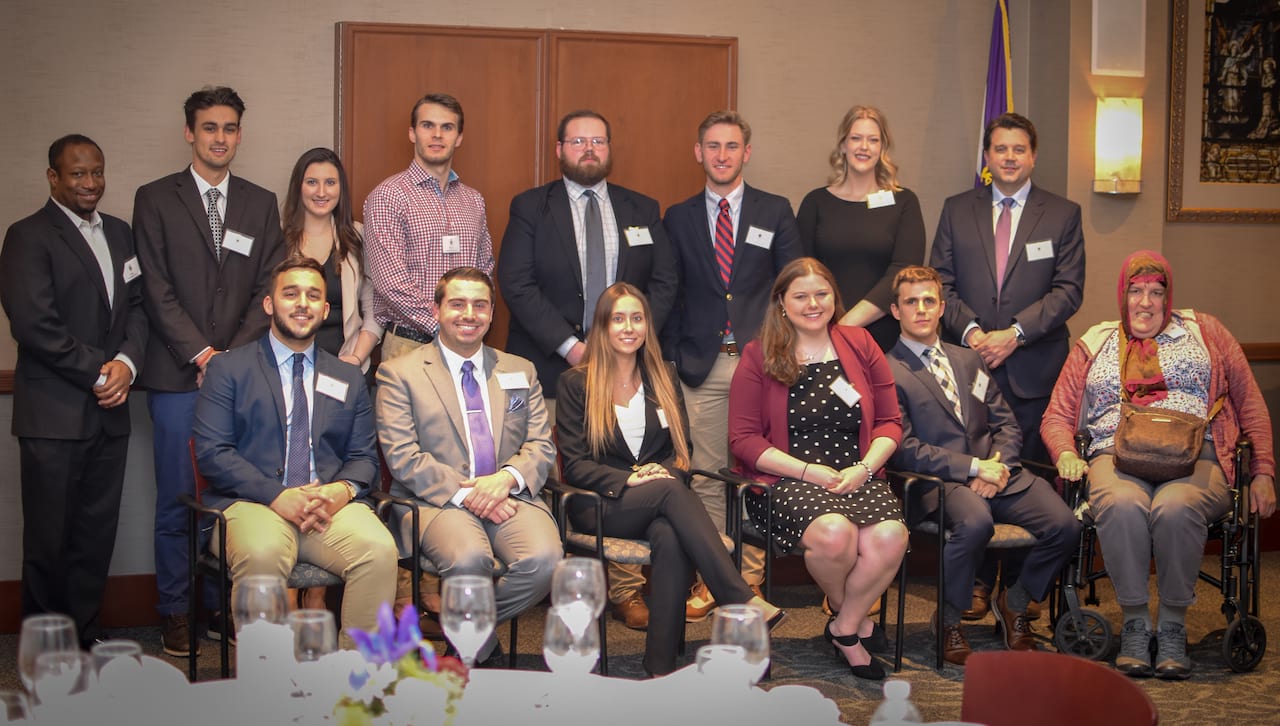 Members of the Class of 2019 share a moment with members of the faculty at the 2019 Pre-Law Advisory Program Banquet. 