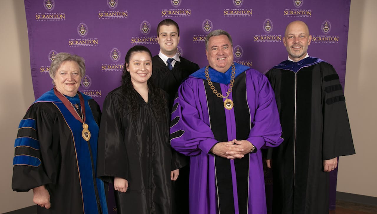 Two members of The University of Scranton’s class of 2022 have been awarded highly-selective 2022-2023 Fulbright grants. From left: Susan Trussler, Ph.D., Fulbright advisor and associate professor of economics and finance at the University; Fulbright award recipients Crysta O’Donnell ’22, who won an English Teaching Assistantship to Andorra, and Peter Amicucci ’22, who won a Fulbright-Lappeeranta University of Technology Graduate Award to Finland; Rev. Joseph Marina, S.J., president of the University; and Jeff Gingerich, Ph.D., provost and senior vice president for academic affairs.