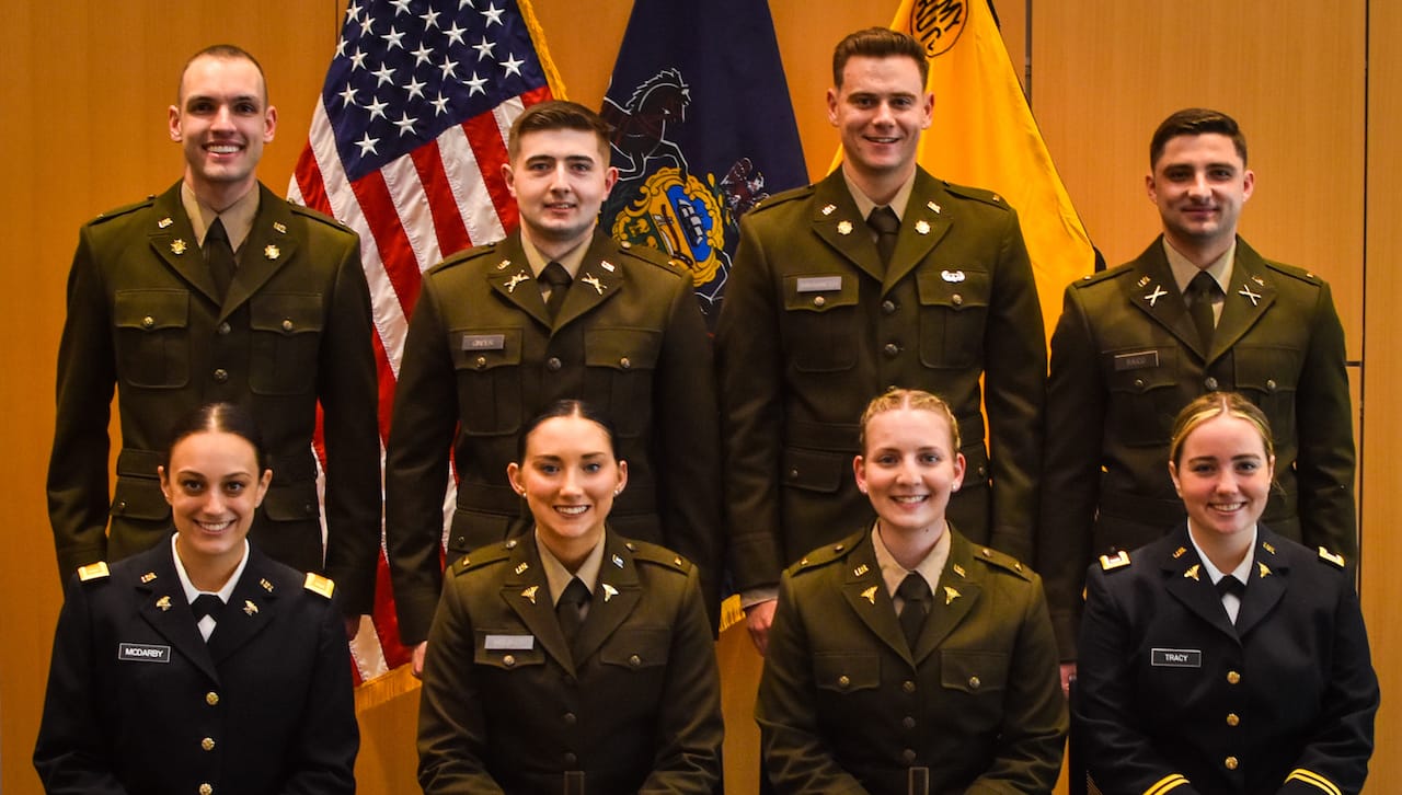 Eight members of The University of Scranton’s Class of 2022 were commissioned as second lieutenants in the U.S. Army during a ceremony held May 21 in the Kane Forum of Leahy Hall on the University’s campus. Seated, from left, are: 2nd Lt. Andrea McDarby; 2nd Lt. Caitlyn Maurer; 2nd Lt. Katelyn Weisz; and 2nd Lt. Brenna Tracy. Standing are: 2nd Lt. Maximilian Sharkey; 2nd Lt. Ryan Ginder; 2nd Lt. John Shaughnessy; and 2nd Lt. Zachary N. Raico.
