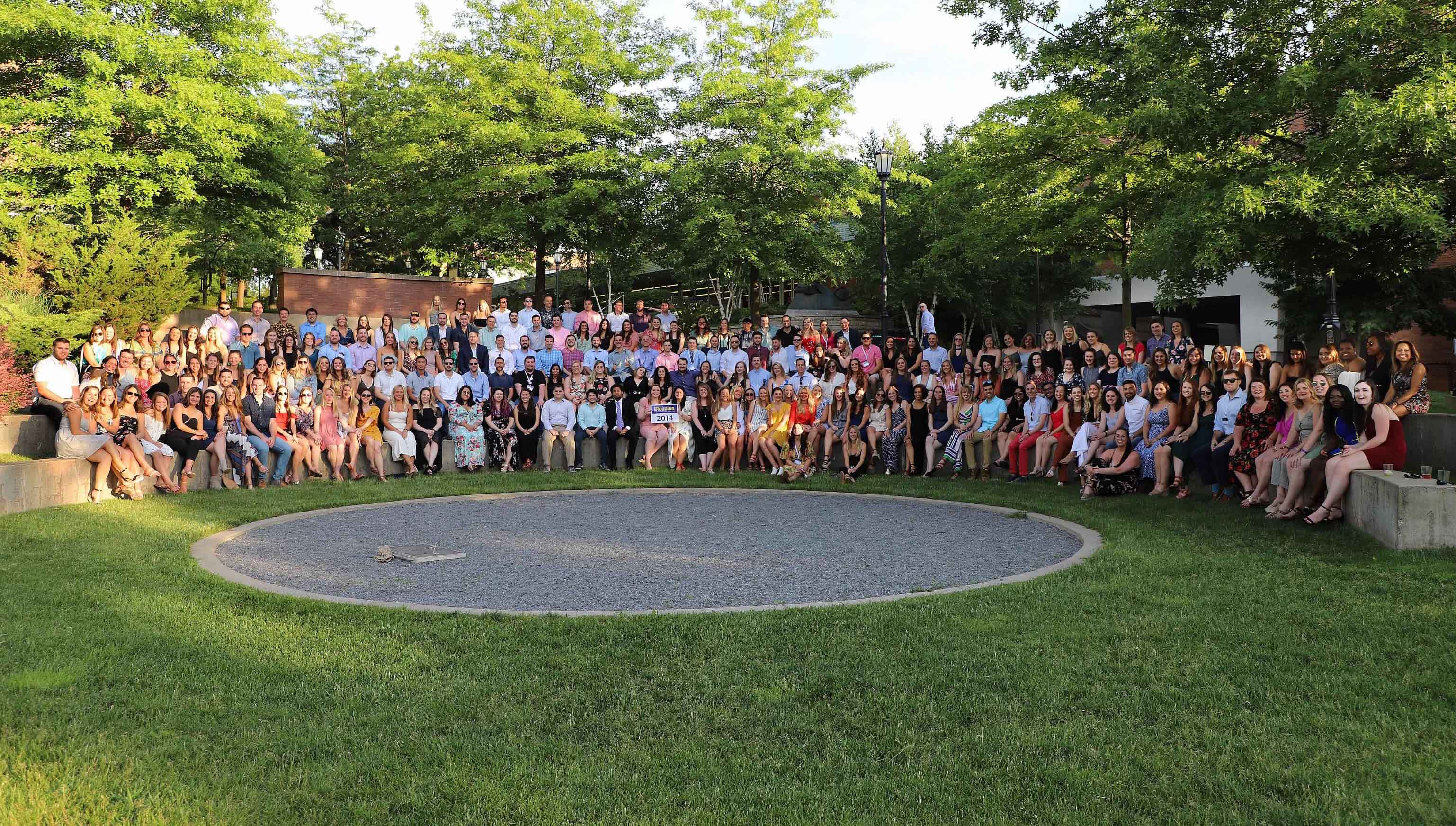 Members of the Class of 2014 gather on the Dionne Green at Reunion Weekend 2019.