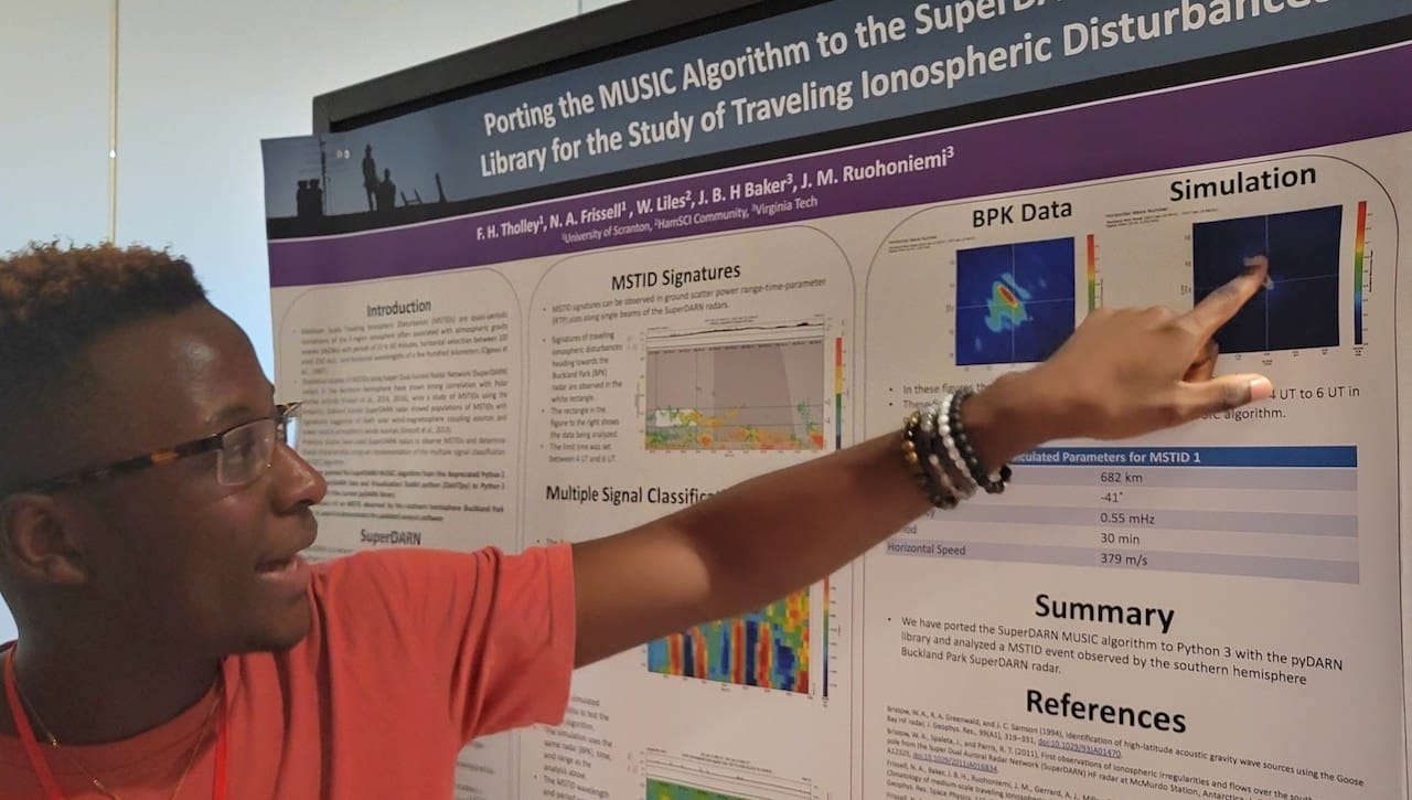 Four University of Scranton students and physics and engineering faculty member Nathaniel Frissell, Ph.D., recently presented their research at the National Science Foundation CEDAR Workshop in Austin, Texas, and 2022 Dayton Hamvention in Xenia, Ohio. Pictured, University student Francis Tholley explains his research at the National Science Foundation CEDAR Workshop.