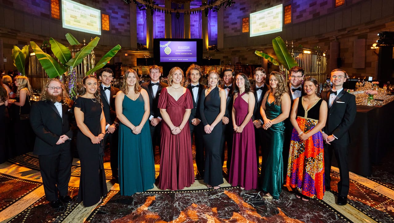 Presidential Scholars of The University of Scranton’s class of 2023 attended the President Business Council’s 21st Annual Award Dinner at Gotham Hall in New York City. Proceeds from the annual dinner support the University’s Presidential Scholarship Endowment Fund. First row, from left: Lauren Cawley, Amanda Lamphere, Sarah Liskcowicz, Emily Amershek, Kathleen Wallace, Angela Hudock, Claire Sunday. Back row: Michael Edwards, Jared Fernandez, Matthew Earley, James Lanning, Muhammad Sarwar, Dominic Finan, Timothy Gallagher, Michael Quinnan. Absent from photo are Molly Neeson, Cameron Shedlock and Daniel Zych.