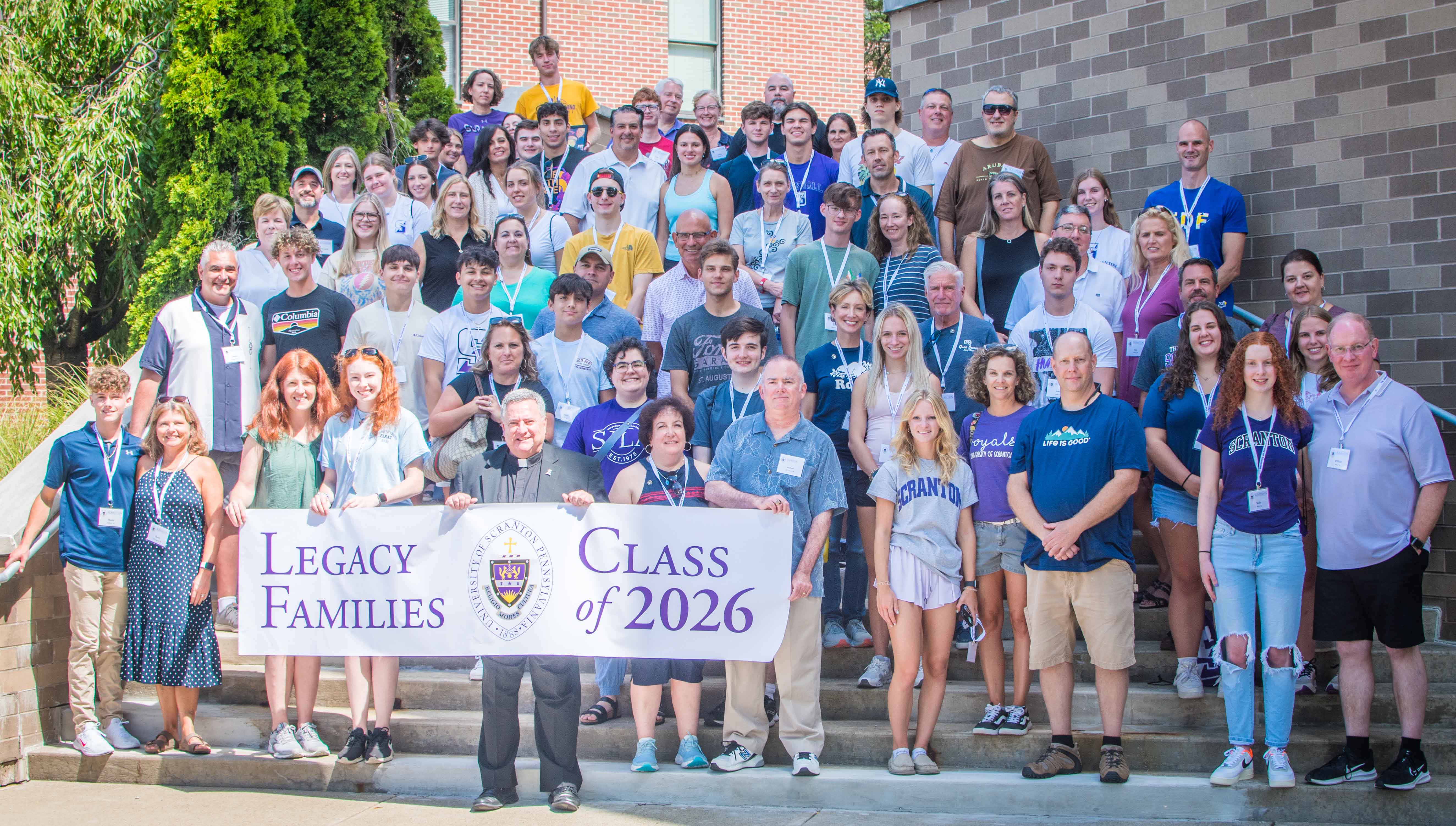 Rev. Joseph G. Marina, S.J., University president, gathers with the Legacy Families of the Class of 2026 at Brennan Hall Aug. 27.