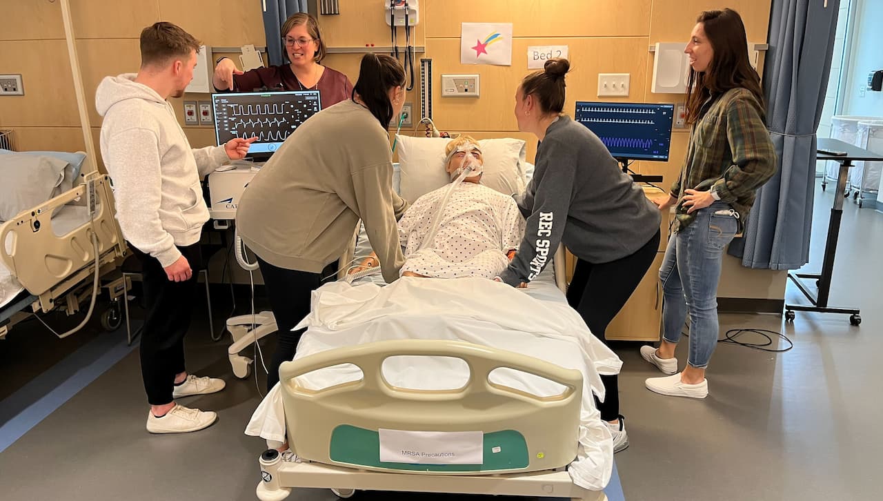 Janette M. Scardillo '05, G'06, DPT'09, incorporates a high-fidelity mannequin into patient simulations for students in the department of Physical Therapy at the Panuska College of Professional Studies. This allows them to gain skills appropriate for inpatient physical therapy settings.Formal simulations have been incorporated into the Advanced Patient Management and Cardiovascular and Pulmonary Physical Therapy courses within the DPT curriculum.