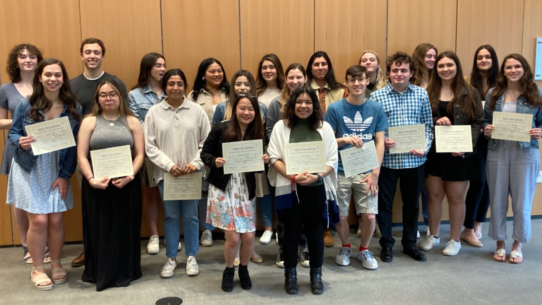 Shown, Alpha Mu Gamma Language Honors Society inductees at the ceremony the past spring.