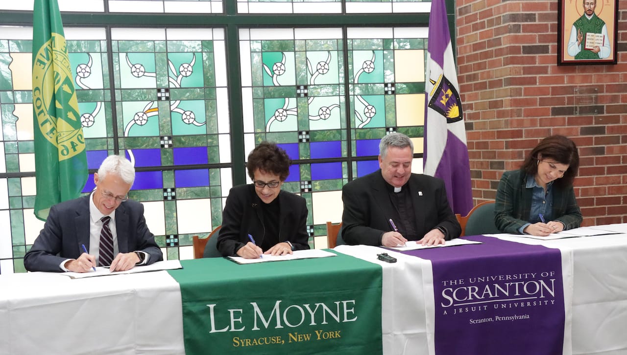 The University of Scranton and Le Moyne College have signed over-arching memorandum of understanding and established pathway programs for direct entry for Le Moyne’s Physician Assistant (PA) program and for guaranteed seats in Scranton’s Doctor of Physical Therapy (DPT) program. From left: James Hannan, Ph.D., provost and vice president for academic affairs, Le Moyne College; Linda LeMura, Ph.D., president, Le Moyne College; Rev. Joseph Marina, S.J., president, The University of Scranton; and Michelle Maldonado, Ph.D., interim provost and senior vice president, The University of Scranton.
