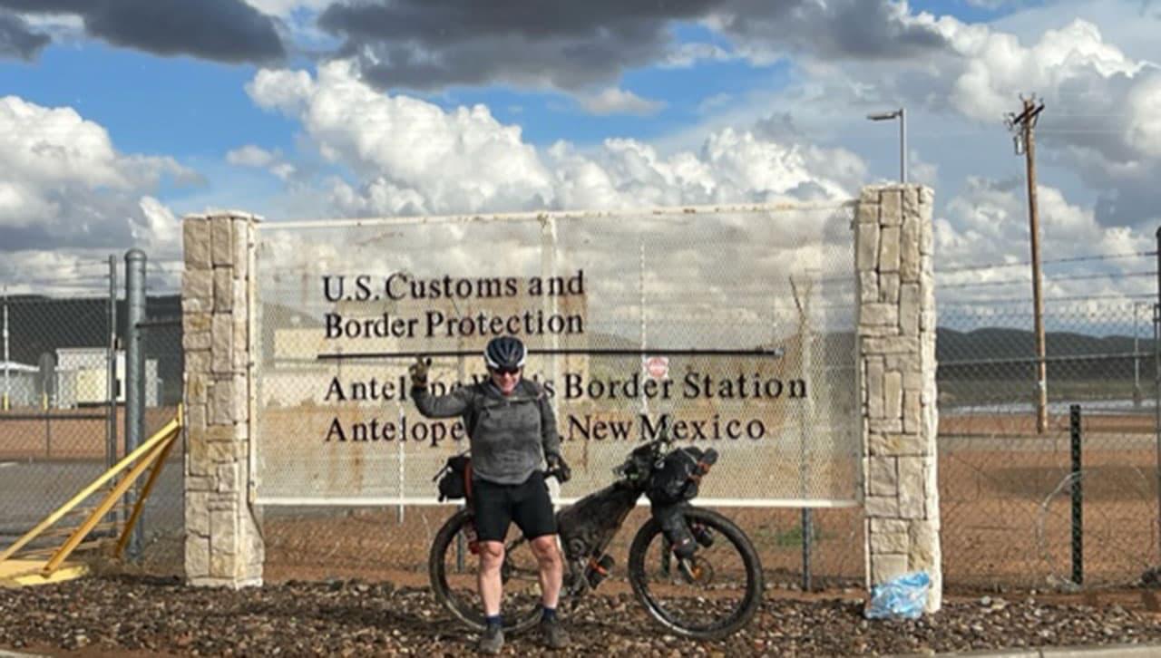 John O’Malley ’87, Lieutenant Colonel, U.S. Army Retired, enjoys a moment of triumph at the U.S.-Mexico border at Antelope Wells, New Mexico, Oct. 8.