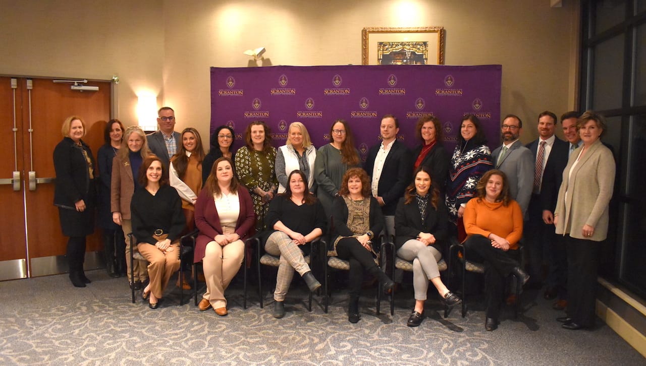 The University of Scranton welcomed the twenty 2023 cohort of students entering Nonprofit Leadership Certificate Program (NLCP). Seated, from left: NLCP students Amy Luyster, Greater Scranton Chamber of Commerce; Kathleen Barry, The Wright Center; Tiffany Benedict, Susquehanna County Women’s Resource Center; Susan Jeffery, Administrator, Hawk Family Foundation; Amy Benjamin, Northern Tier Regional Planning and Development Commission; and Erica Rogler, Wyoming County Cultural Center/Dietrich Theater. Standing: Linda Ciampi, NLCP peer group coach; Maria Montoro Edwards, Ph.D., NLCP peer group coach; and Barbara Norton, NLCP peer group coach; and NLCP students Art Levandoski, Jewish Family Services; Avianna Carilli, The University of Scranton; Jennifer Passaniti, Center for Health and Human Services Research and Action; Arrah Fisher, The Cooperage; Laura Boyle, Scranton Youth Arts Coalition; Joan Peterson, Court Appointed Special Advocates, Lackawanna County; Josh Nespoli, Community Strategies Group; Shane Powers, NeighborWorks NEPA; Lori Chaffers, Outreach; and Matthew Ceruti, United Way of Lackawanna, Wayne and Pike Counties; Jesse Ergott, NLCP co-coordinator; Kurt Bauman, NLCP co-coordinator and Cindy Yevich, NLCP peer group coach. Absent from photo were NLCP students Glynis Johns, Black Scranton Project; Andrew Chew, The Institute; Lauren Cleveland, Friendship House; and John Santa Barbara, , American National Red Cross.