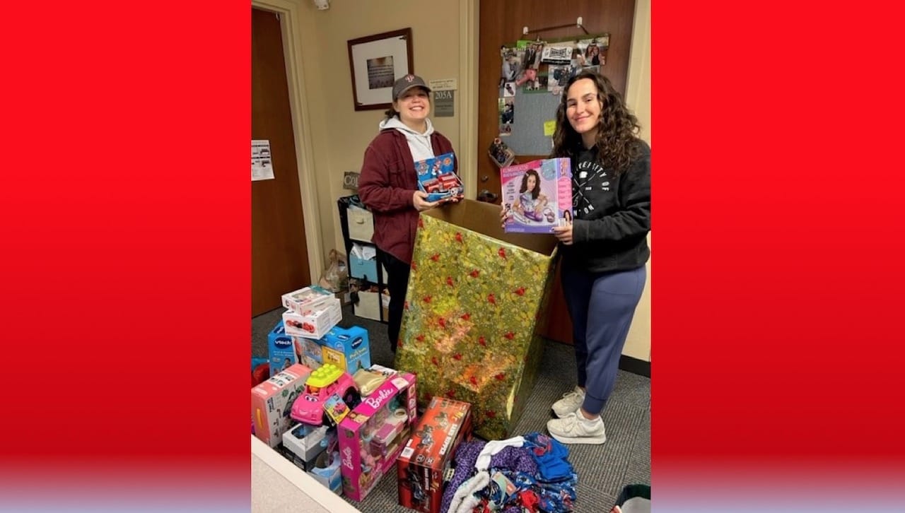 The University of Scranton’s Center for Service and Social Justice held their annual Christmas giving programs to help area families in need during the holiday season. From left: University seniors Kate Franceschelli, Spring Brook Township, and Sophia McMullan, Cranford, New Jersey, begin to sort donated gifts.