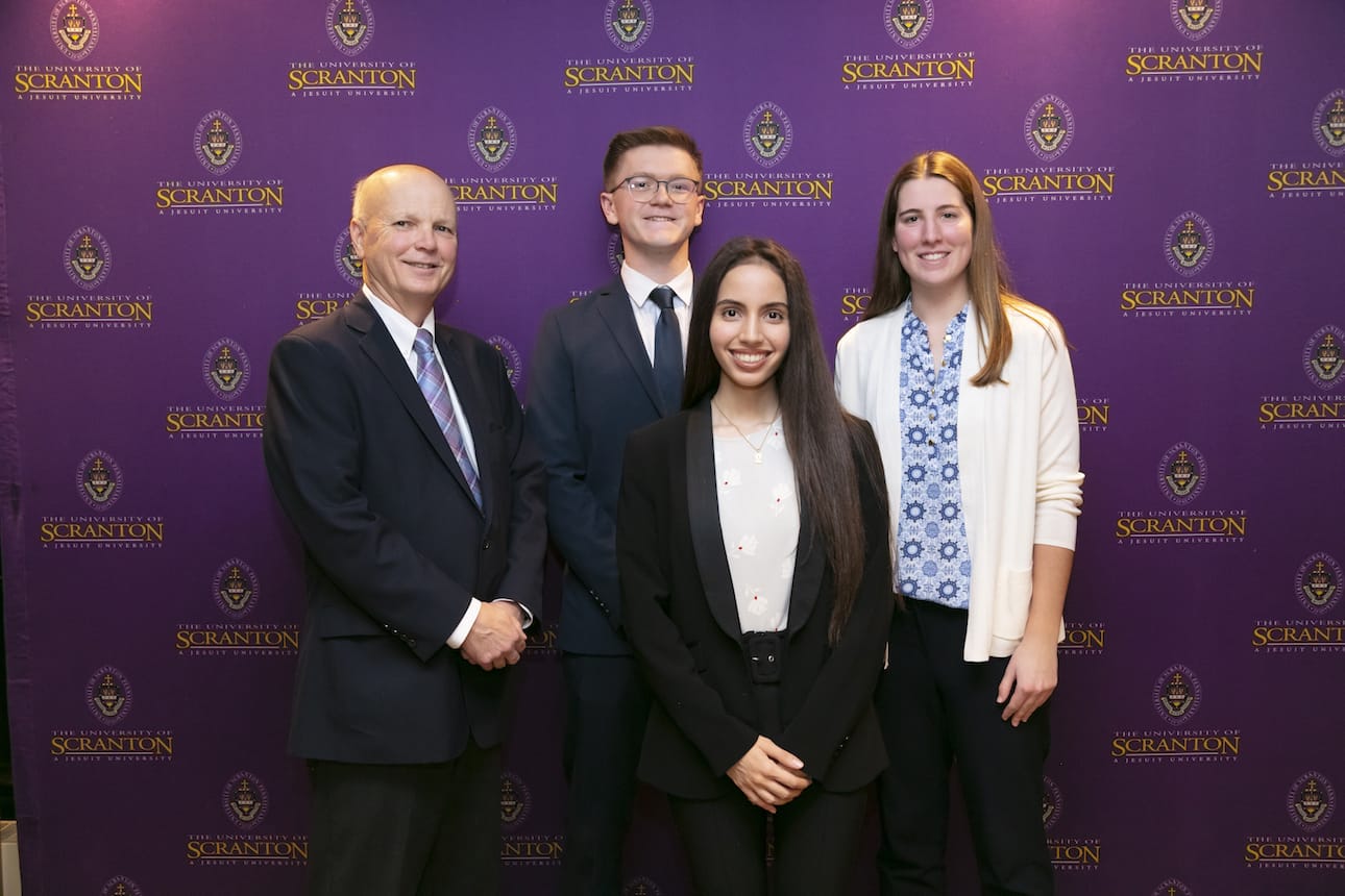 University of Scranton students were recently given Frank O’Hara medals in recognition of having the highest grade-point averages in their first-, second- and third-year in the College of Arts and Sciences, the Kania School of Management and the Panuska College of Professional Studies for the 2021-22 academic year. From left: Mark Higgins, Ph.D., dean of the Kania School of Management, and O’Hara Award recipients Samuel Hannah, Alice Banks and Madalyne Buhler.