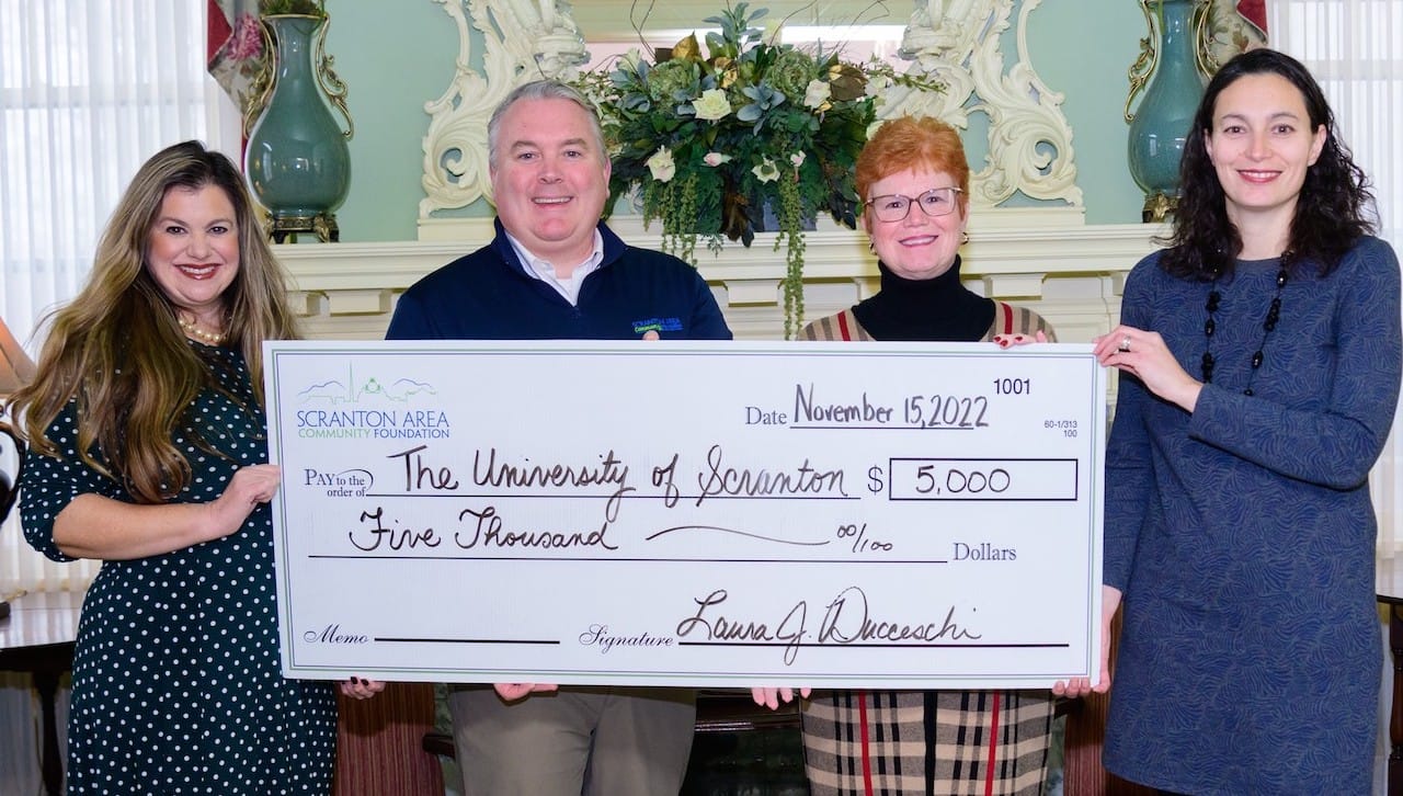 The Scranton Area Community Foundation awarded a $5,000 grant to The University of Scranton to support the ongoing “Scranton’s Story, Our Nation’s Story” project. From left: Laura Ducceschi, president and CEO, Scranton Area Community Foundation; Bobby Lynett, board member, Scranton Area Community Foundation; Meg Hambrose, director of corporate and foundation relations, The University of Scranton; and Julie Schumacher Cohen, assistant vice president of community engagement and government affairs, The University of Scranton.