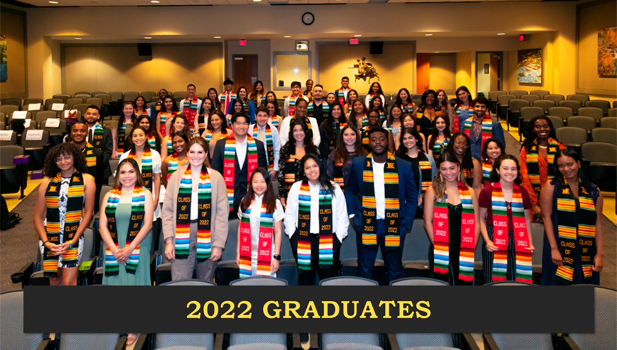 Graduates of the class of 2022 gather in the Moskovitz theater wearing their bright, multicolor stoles presented to them during the ceremony. 