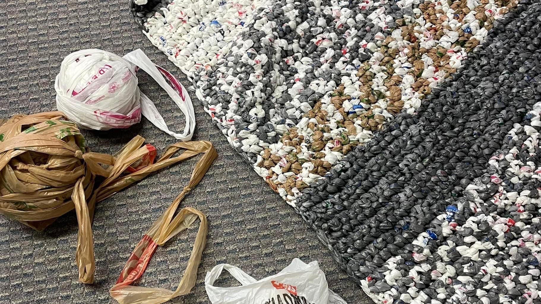 Shown are ingredients for the April 21 plastic bag mat-making workshop at The Weinberg Memorial Library. The process will include cutting plastic bags into strips, creating plastic yarn known as “plarn” and crocheting the plarn into mats, shown. 