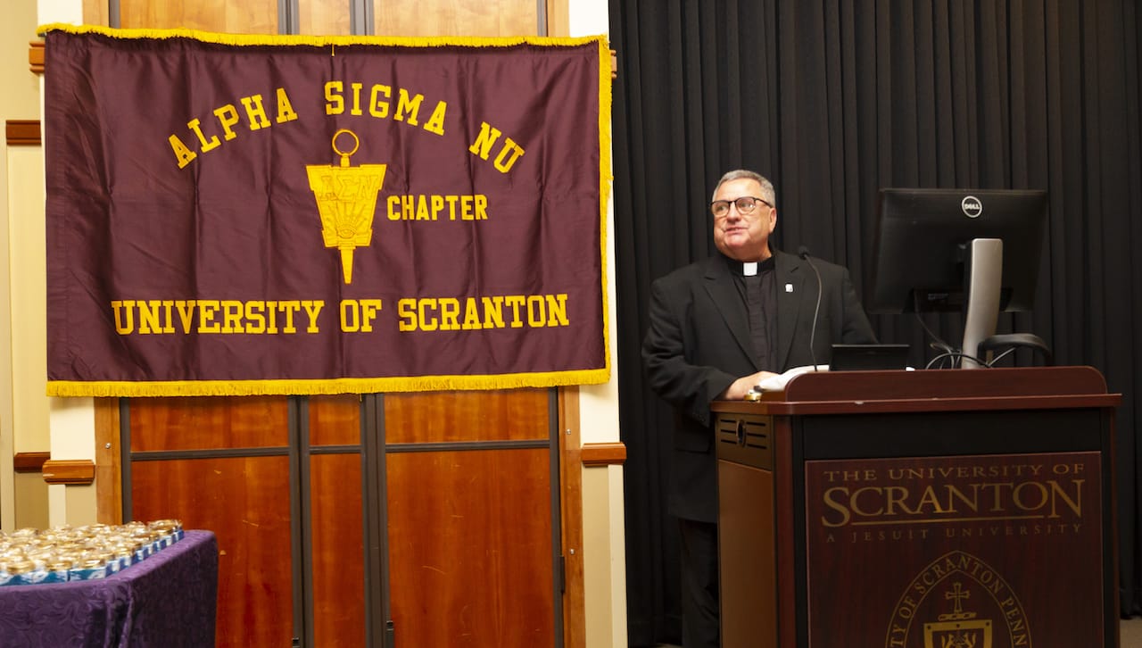 University of Scranton President Rev. Joseph Marina, S.J., speaks at the Alpha Sigma Nu Honor Society Induction Ceremony. Seventy-one University of Scranton students were inducted into the national honor society for students in Jesuit colleges and universities.