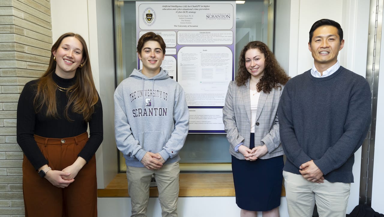 Nearly 100 students participated in The University of Scranton’s Celebration of Student Scholars. Among the students presenting research were, from left, undergraduate students Zoe Honney, Scranton; Andrew Fernandez, Basking Ridge, New Jersey; and Jessica Sommo, Commack, New York; with faculty mentor Sinchul Back, Ph.D., assistant professor of criminal justice, cybersecurity and sociology.