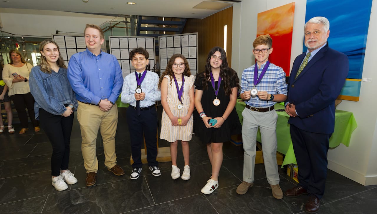 The University of Scranton announced the winners of its Earth Day Essay Contest for students in grade 5. From left: University of Scranton students Amelia Farry, South Abington Township, and Nathaniel Smith, Wilkes-Barre; Earth Day Essay Contest medalists Griffin Maynor, All Saints Academy, Lila Tallo, All Saints Academy, Talia Lameo, All Saints Academy, and Liam Marante, All Saints Academy; and Mark Murphy, director of the Office of Sustainability at the University.