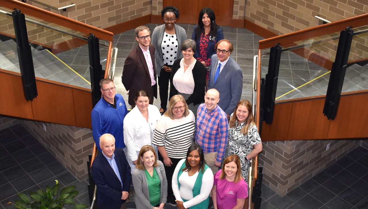 Pictured, first row, from left: Mark Higgins, Ph.D., dean, Kania School of Management; Lisa Hall Zielinski, director of Scranton’s SBDC; and Scranton SBDC Business Consultants Zakiyyah Smith and Gretchen Kukuchka. Second row: Scranton SBDC Business Consultants Keith Yurgosky and Leigh Fennie; Elizabeth Geeza, program coordinator; Patrick Keehan, SBDC business consultant; and Katelyn McManamon, special projects coordinator. Third row: representing the Pennsylvania SBDC: Brian Kelly, associate state director; Tiffany Thompson, director of administration; and Ernie Post, Ph.D., state director. Fourth row representing the Pennsylvania SBDC: Juliet Njoroge, budget/grant analyst; and Francene Dudziec, director of marketing. Not pictured: Winifred McGee, Scranton SBDC business consultant.
