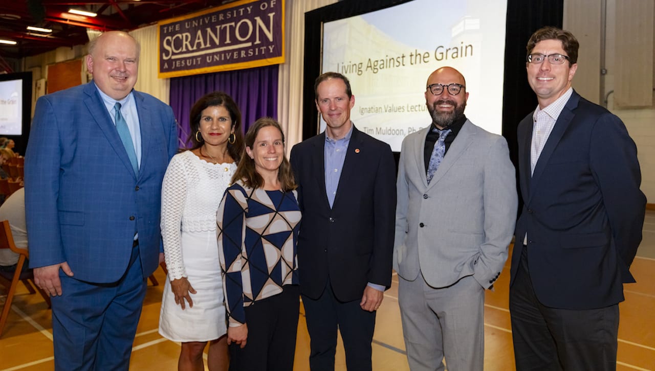 The Award-winning author of “Living Against the Grain: How to Make Decisions that Lead to an Authentic Life” spoke to students at The University of Scranton’s 2023 Ignatian Values in Action Lecture. From left: David Marx, Ph.D., associate provost of academic affairs; Michelle Maldonado, Ph.D., provost and senior vice president of academic affairs; Maria Squire, Ph.D., interim associate dean of the College of Arts and Sciences; guest speaker Timothy Muldoon, Ph.D.; Robert Willenbrink, Ph.D., associate professor of English and theatre; and David Dzurec, Ph.D., interim dean of the College of Arts and Sciences.