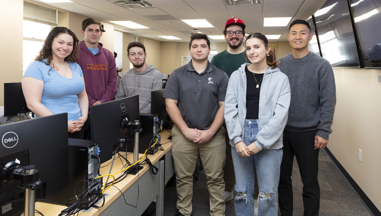 Students representing The University of Scranton came in second place and third place in cyber security simulation student competition hosted by Endicott College in Massachusetts. From left,members of the team that placed third, Jessica Sommo, Colin Straub and Brian Callery; members of the team that placed second, Frank Magistro, John McMonagle and Buse Onat; and Sinchul Back, Ph.D., assistant professor and director of cybercrime and cybersecurity at the University. All six students are majoring in cybercrime and homeland security at Scranton.