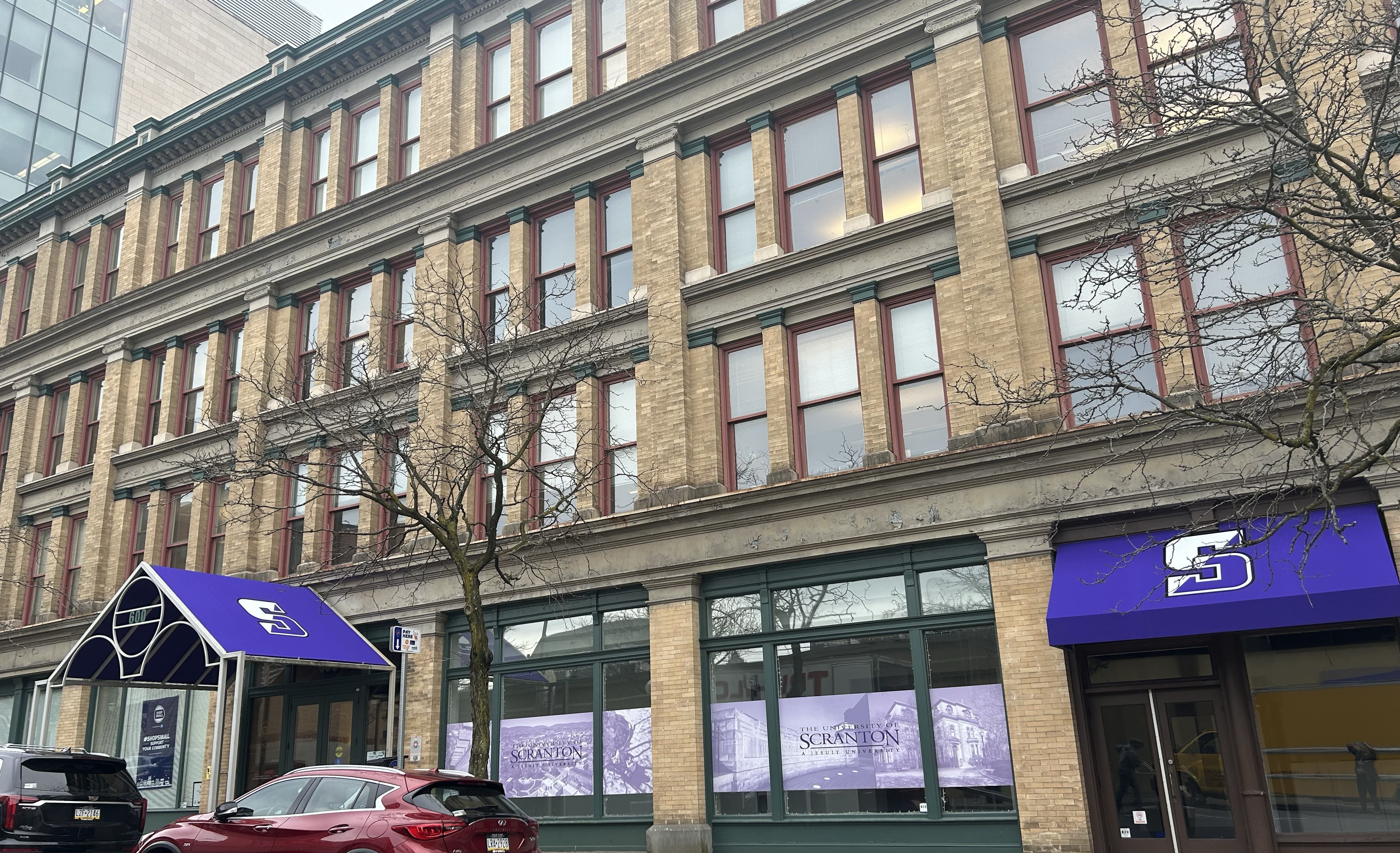 Louis Stanley Brown Hall, 600 Linden Street, received a flourish of The University of Scranton's signature purple with the March 26 installation of a new canopy and awning, shown. The first phase of updates to the building began last fall with an addition of digital window pictures on the building's first floor exterior.