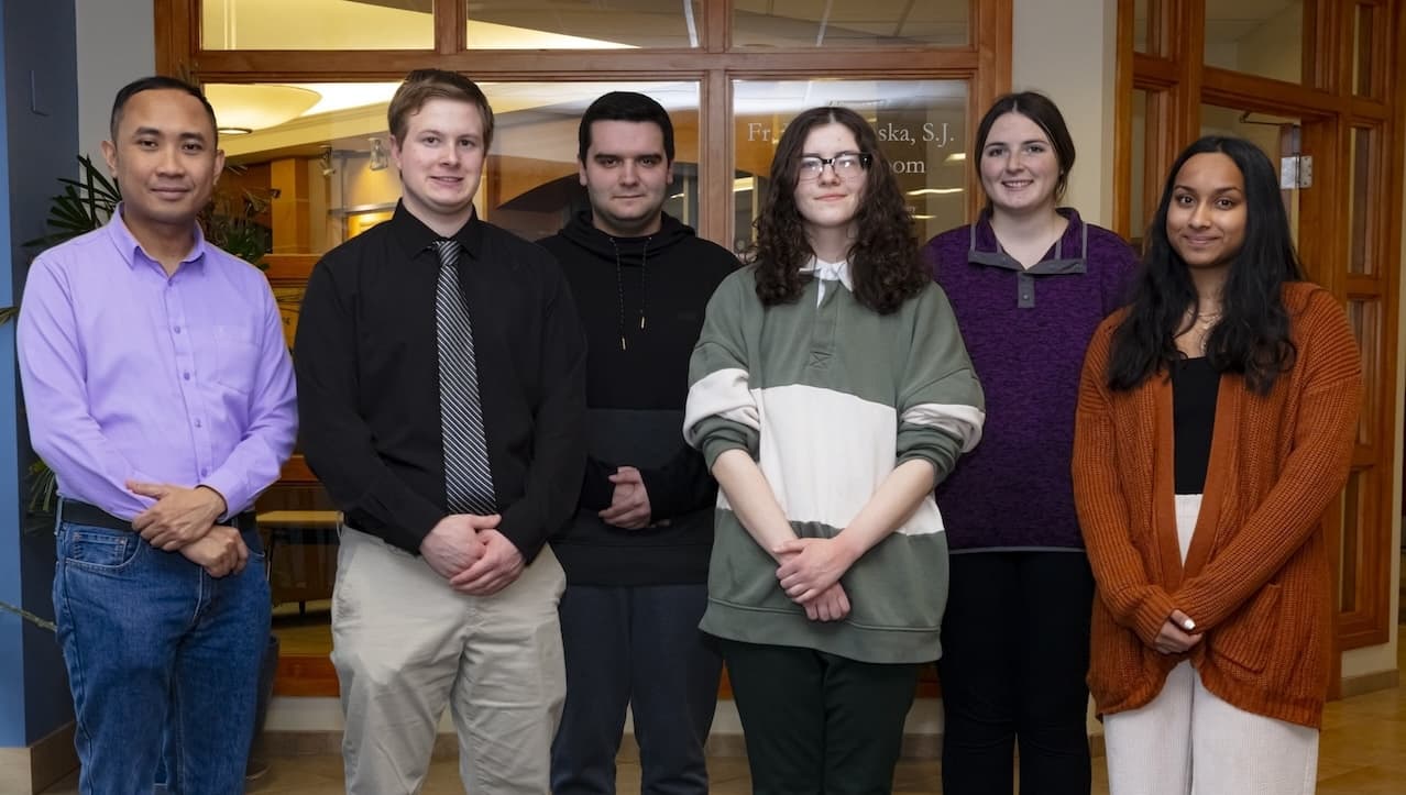 Five University of Scranton graduate students who were selected as National Science Foundation Noyce Scholars are student teaching this semester at four area school districts. The NSF Noyce Scholar program at Scranton is supported by a five-year grant awarded to Gerard Dumancas, Ph.D., associate professor of chemistry Scranton, which provides training and financial support to University secondary education majors in STEM fields who wish to teach at high schools in high-need school districts. From left are Dr. Dumancas and Scranton’s NSF Noyce Scholars Jacob Vituszynski, Matthew Byrnes, Nina Bowen, Makenzie Bell and Gracie Silva.