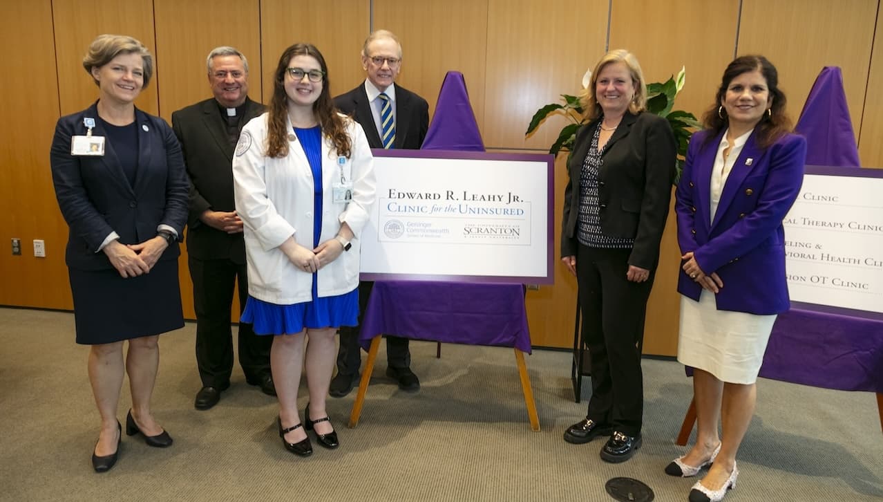 The University of Scranton and Geisinger Commonwealth School of Medicine hosted a grand re-opening ceremony and open house for the Edward R. Leahy, Jr. Clinic for the Uninsured. From left: Julie Byerley, M.D., president, Geisinger College of Health Sciences; Rev. Joseph Marina, S.J., president of The University of Scranton; Olivia Zehel, first-year medical student, Geisinger Commonwealth School of Medicine and 2023 graduate of The University of Scranton; Edward R. Leahy, University benefactor; Victoria Castellanos, Ph.d., dean of the Leahy College of Health Sciences, The University of Scranton; and Michelle Maldonado, Ph.D., provost and senior vice president for academic affairs, The University of Scranton.