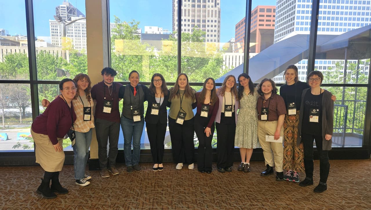 Ten University of Scranton students and one alumnus presented their work at the Sigma Tau Delta International Convention in St. Louis, Missouri in April. From left, current University of Scranton students Amelia Semple and Brenna Parker; alumnus Elias Kerr; faculty co-moderator Dr. Billie Tadros, Ph.D.; current students Faith Montagnino, Shannon Parker, Bethany Belkowski, Megan Zabrouski, Jillian Tremblay, Dimitri Bartels-Bray, and Maille Allardyce; and faculty co-moderator Madeline B. Gangnes, Ph.D. Student presenter Therese Shimkus not pictured.