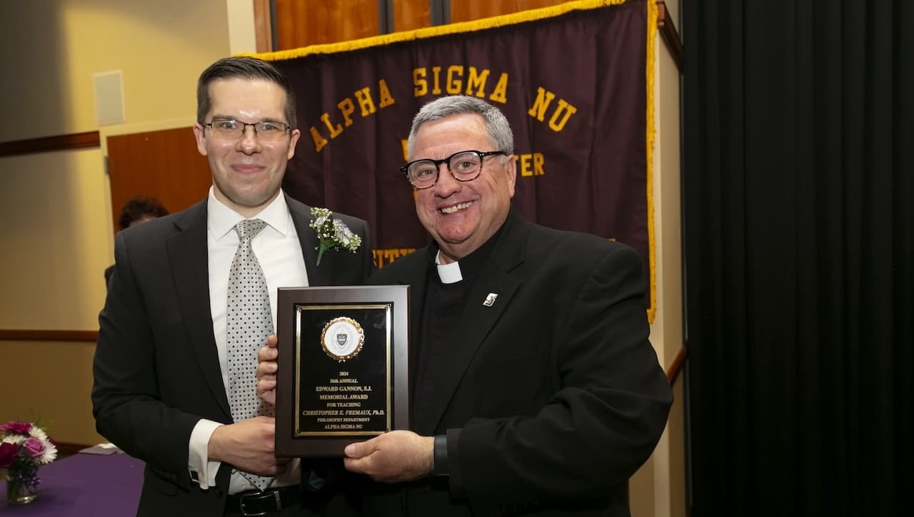 University of Scranton President Rev. Joseph Marina, S.J. (right), congratulates Christopher Fremaux, Ph.D., assistant professor of philosophy, on receiving the 2024 Gannon Award for Teaching. University student members of Alpha Sigma Nu, the national honor society for students in Jesuit colleges and universities, select the professor to be honored.
