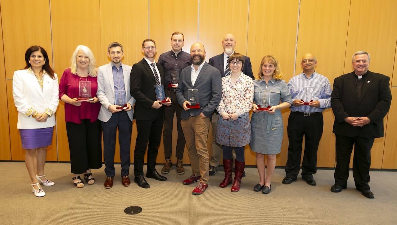 Ten University of Scranton faculty members were honored with Provost Faculty Enhancement awards for excellence in teaching, scholarship or service for 2024. From left are: Michelle Maldonado, Ph.D., former provost and senior vice president for academic affairs; award recipients Lori Bruch, Ed.D., Mehmet F. Bastug, Ph.D., Michael Landram., Ph.D., Prof. Ian O’Hara, Hank Willenbrink, Ph.D., Michael Allison, Ph.D., Madeline Gangnes, Ph.D., Kimberly Pavlick, Ph.D., and Satyajit Ghosh, Ph.D.; and Rev. Joseph Marina, S.J., president. Gerard Dumancas, Ph.D., was absent from the photo.
