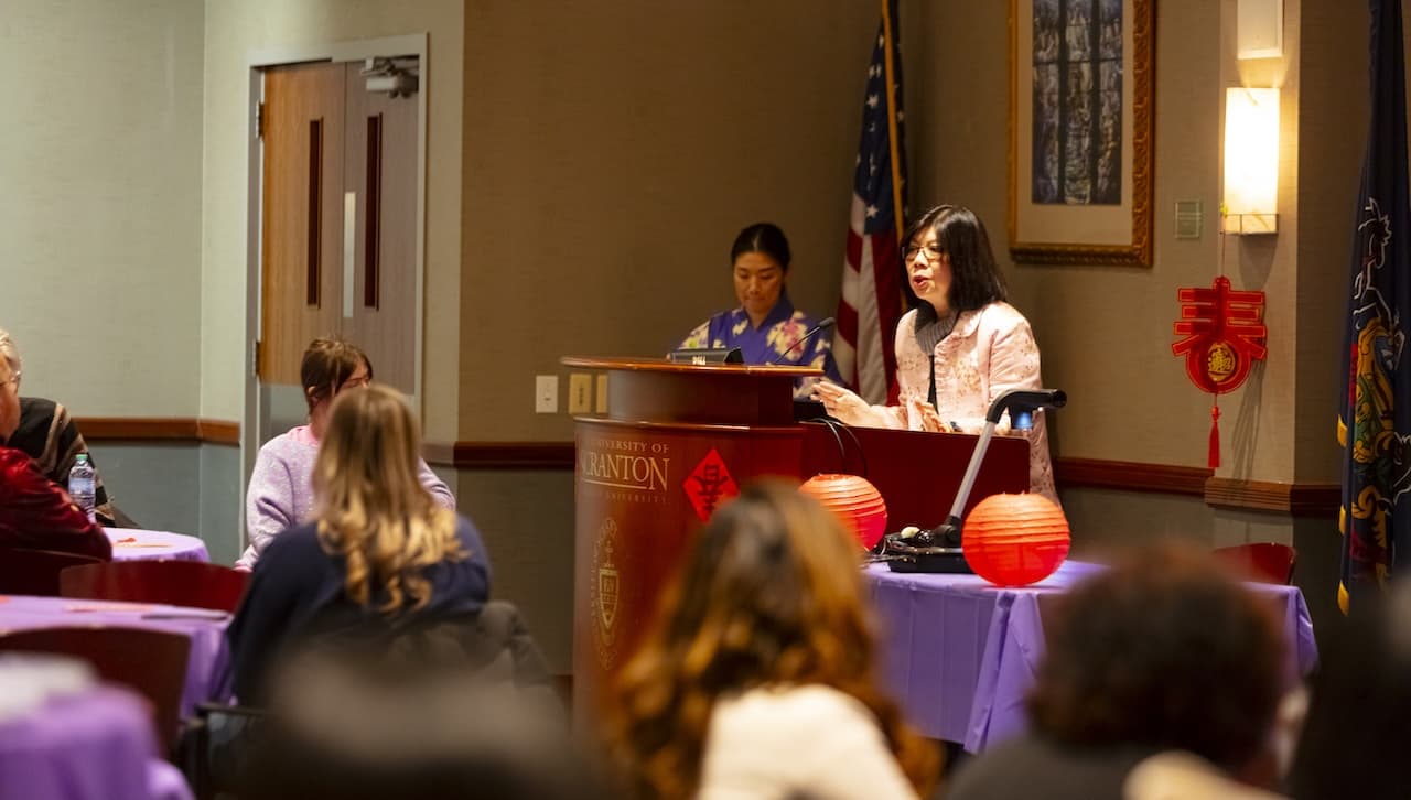 The Asian Studies Program and the World Languages and Cultures Department at The University of Scranton hosted an Asian New Year Festival and Workshop on campus that included hands-on lessons on Chinese calligraphy and Japanese origami. Pictured: Ann A. Pang-White, Ph.D., professor of philosophy and director of Asian Studies, welcomes guests to the Asian New Year Festival and Workshop at the University.