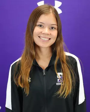 young woman in purple shirt