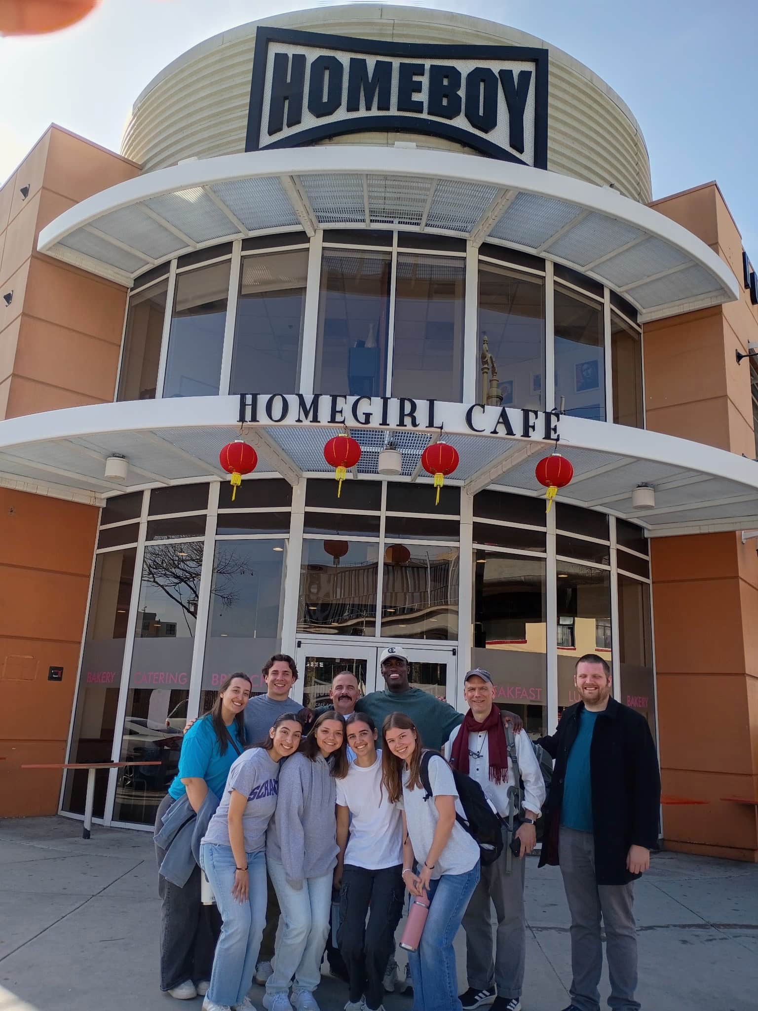 Homeboy building with group of students in front