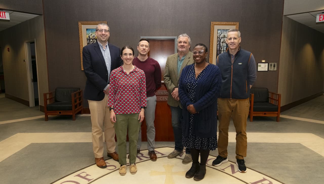 University of Scranton faculty and staff members who went on a pilgrimage to El Salvador to learn about Jesuit Martyrs and St. Oscar Romero, spoke about their experience at a Spirituality Luncheon hosted by the University’s Jesuit Center. This year marks the 45th St. Oscar Romero’s death. Speaking at the luncheon, were, from left, Daniel Cosacchi, Ph.D., vice president for mission and ministry; Megan Heeder, Ph.D., assistant professor of theology and religious studies; Michael Jenkins, Ph.D, chair and professor of criminal justice, cybersecurity and sociology; John Wiercinski, faculty specialist, health administration and human resources; Jacqueline O’Duor, clinical social worker; and Brian Snee, Ph.D., associate professor of communication and media.
