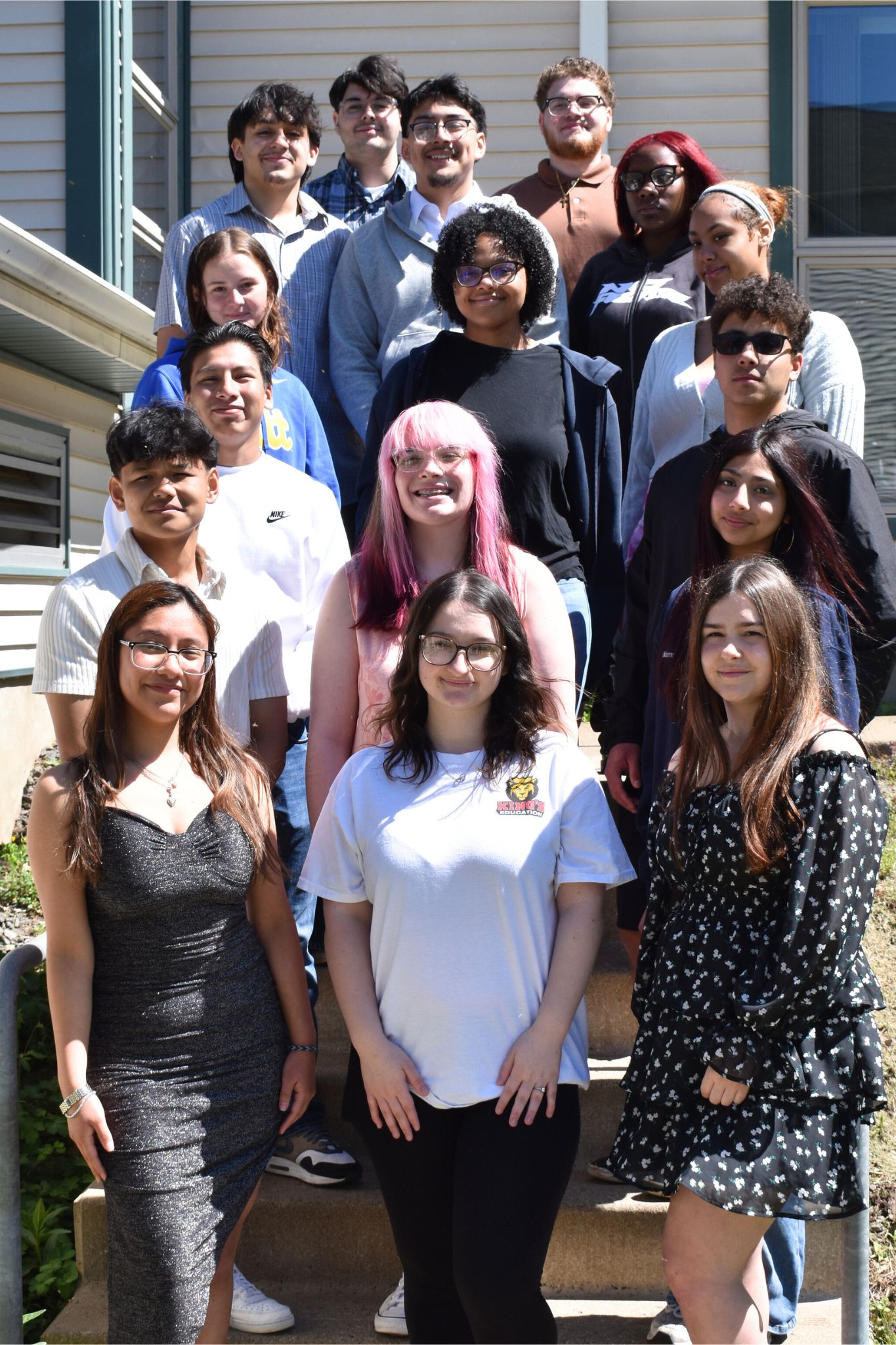 Group photo of a group of students posing together outdoors.