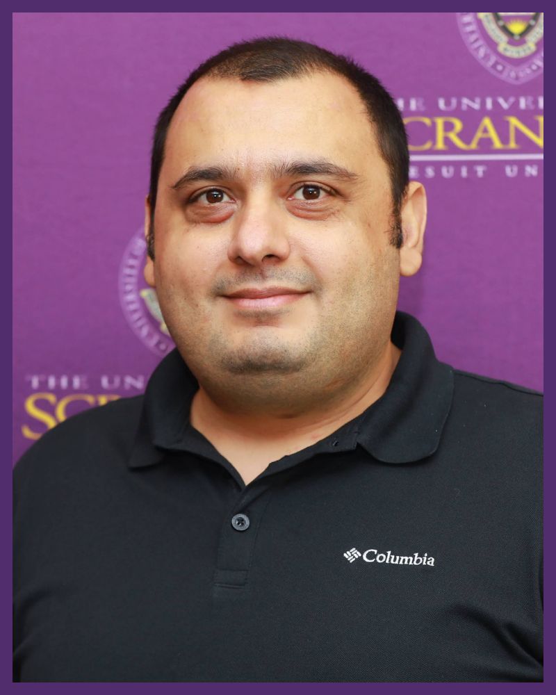a portrait of an individual with short, dark hair